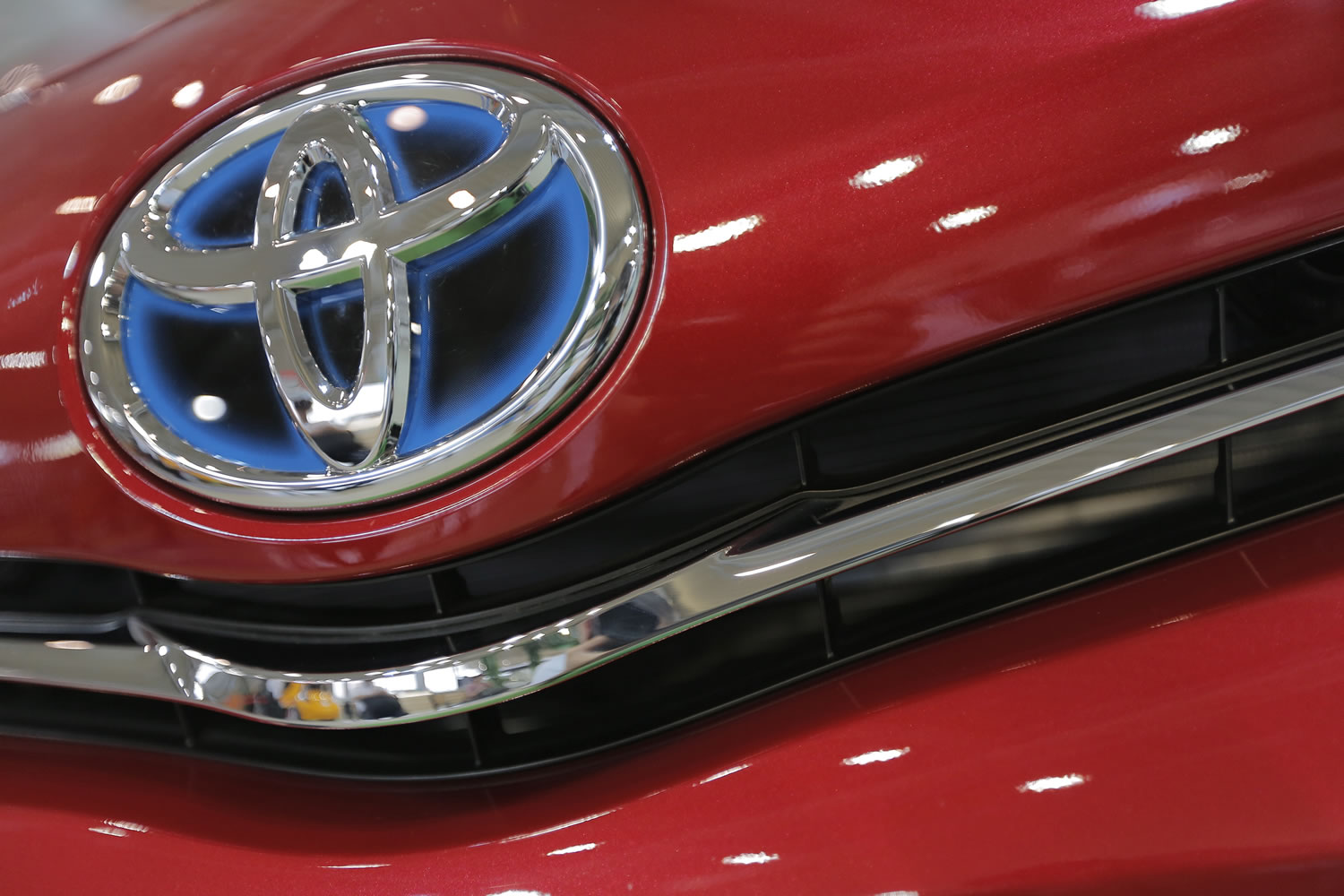The emblem of a Toyota car shines at Toyota Motor Corp.'s showroom Toyota Mega Web in Tokyo.