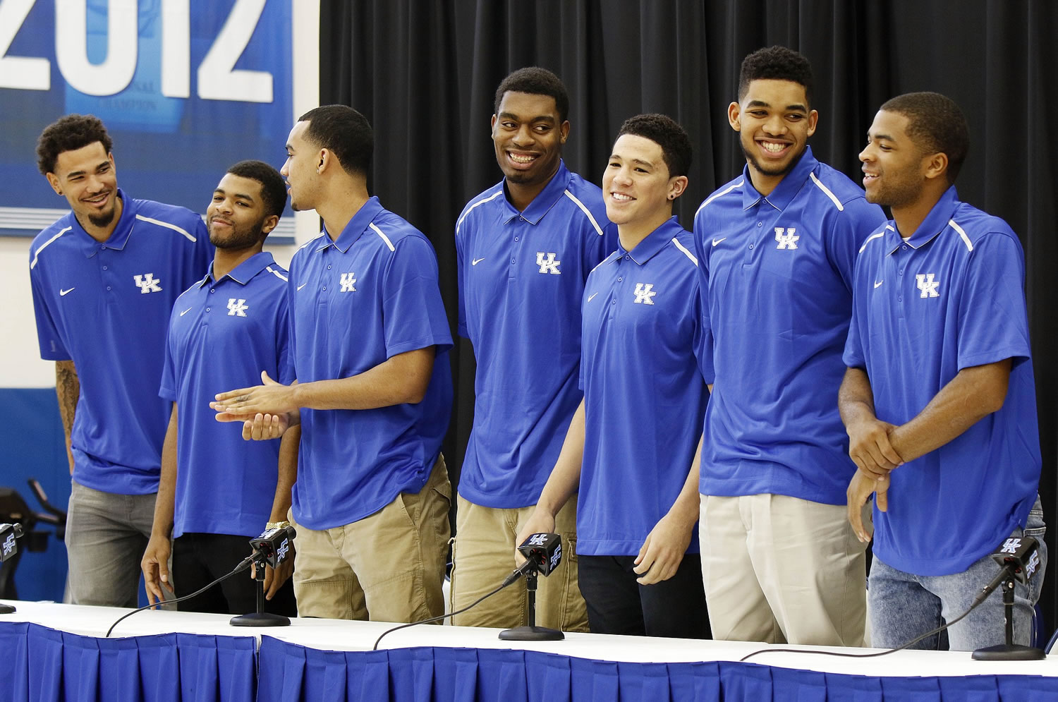 From left, Kentucky NCAA college basketball players Willie Cauley-Stein, Andrew Harrison, Trey Lyles, Dakari Johnson, Devon Booker, Karl-Anthony Towns and Aaron Harrison stand during a news conference where they announced Thursday, April 9, 2015, their intent to place their names in the NBA draft.