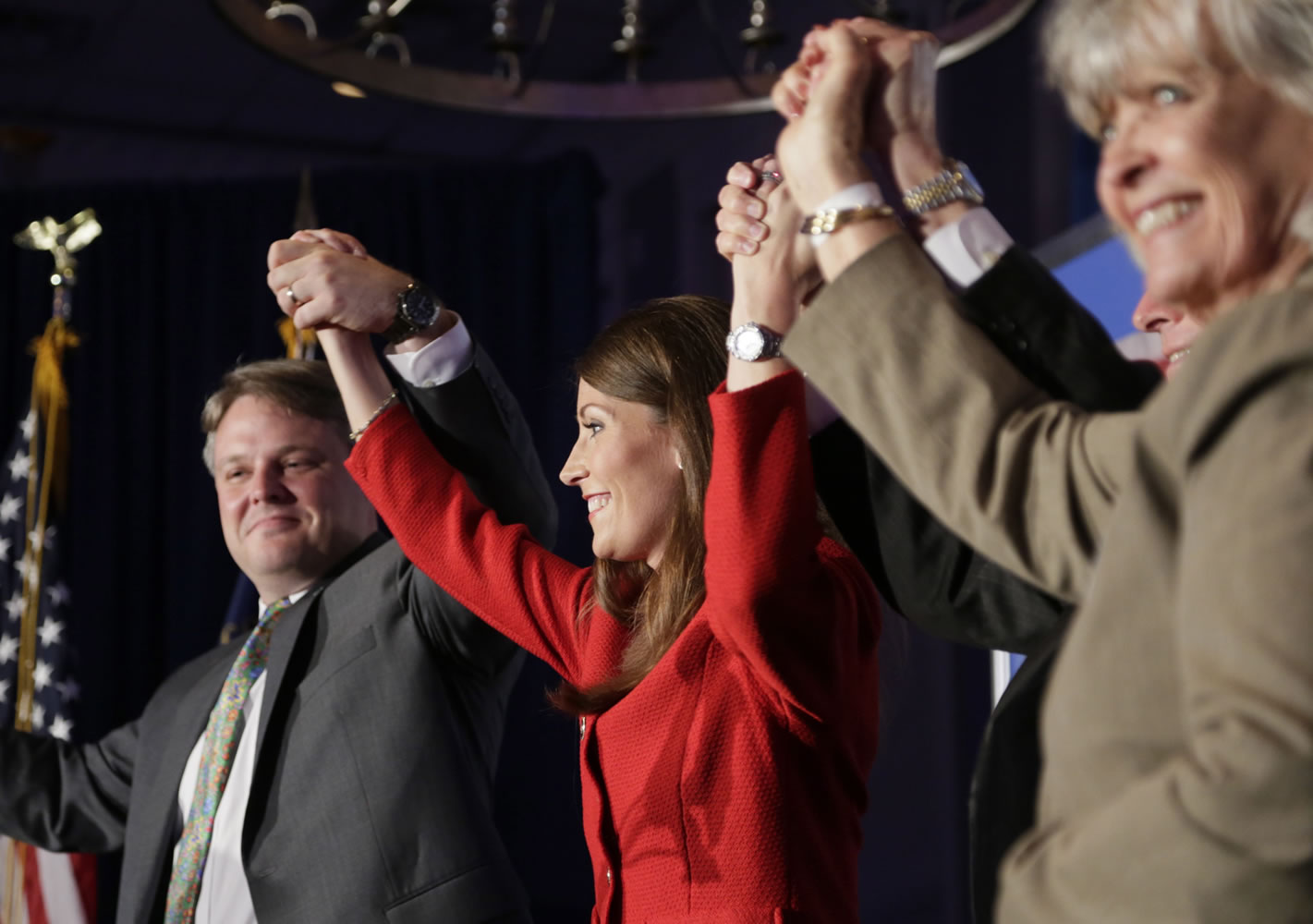 U.S. Senate candidate Alison Lundergan Grimes, center, celebrated on stage with husband Andrew Grimes, left, Gov. Steve Beshear, second from right, and former Gov.