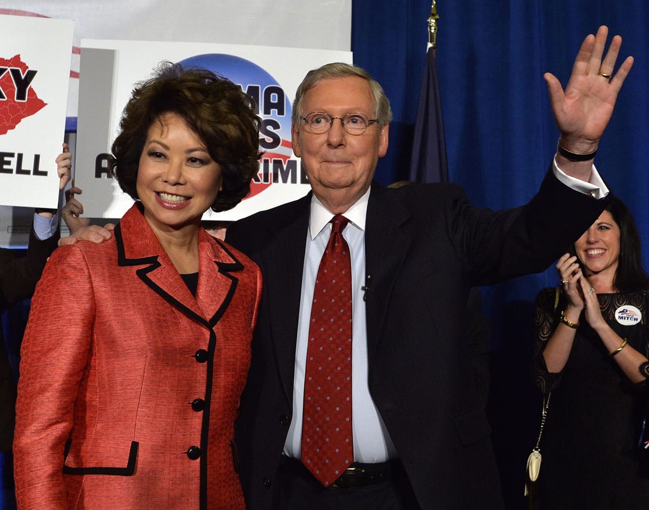 Kentucky Senator Mitch McConnell and his wife, Elaine Chao, wave to supporters following his victory in the Republican primary Tuesday in Louisville, Ky.