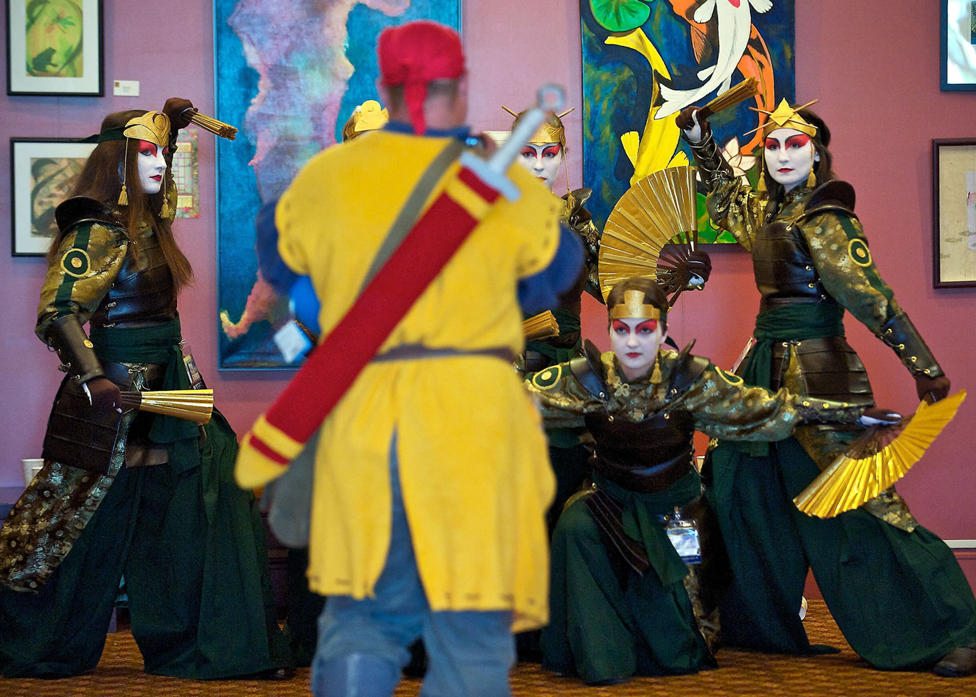 Kumoricon attendees from Salem, Ore., dressed as Kyoshi Warriors from the Nickelodeon series &quot;Avatar: The Last Airbender&quot; pose for a photograph in 2013.