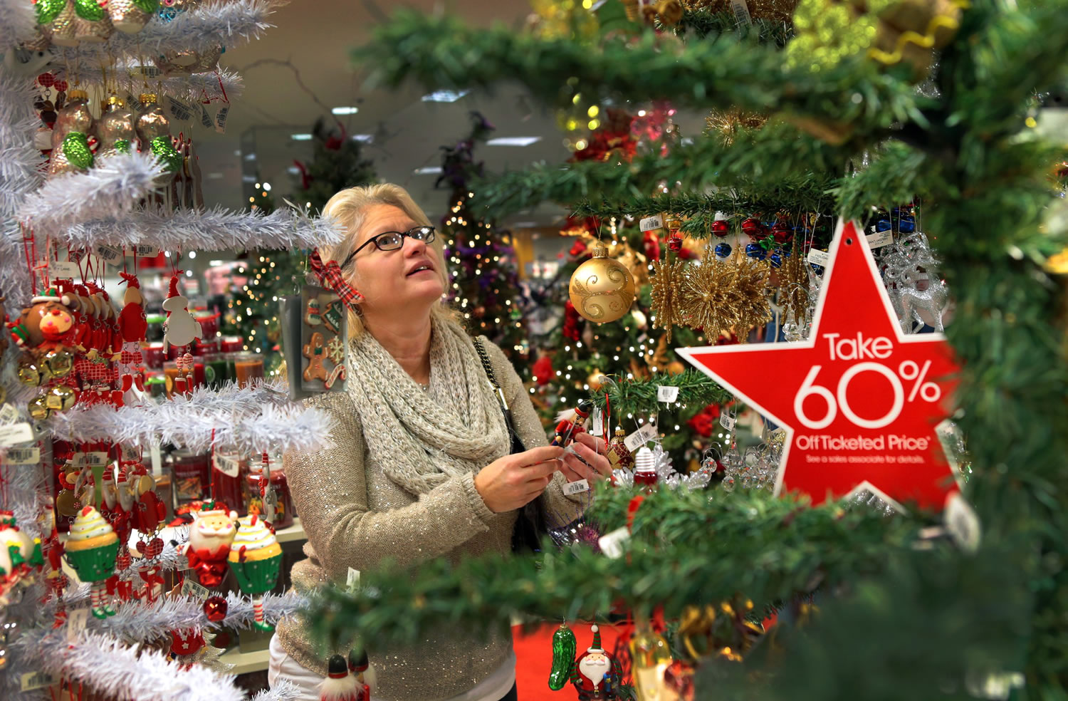 Julie Kuehner shops for ornaments for her grandchildren at Macy's in the St.