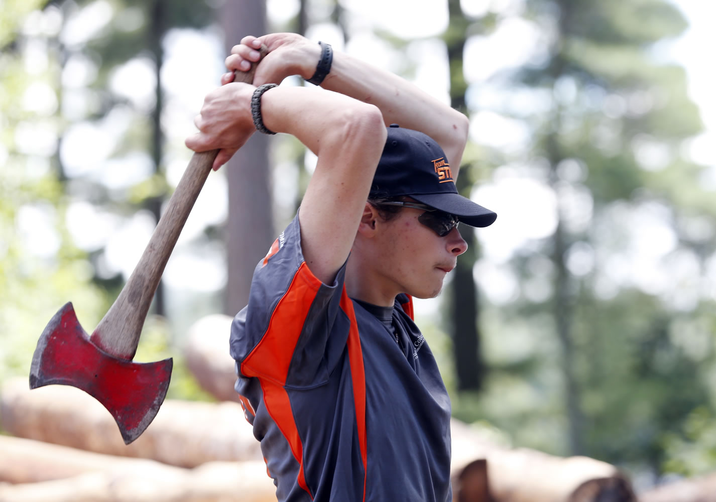 Frederick Wright of Burrillville, R.I., takes aim in the ax throw event at the Adirondack Woodsmen's School at Paul Smith's College in Paul Smiths, N.Y.