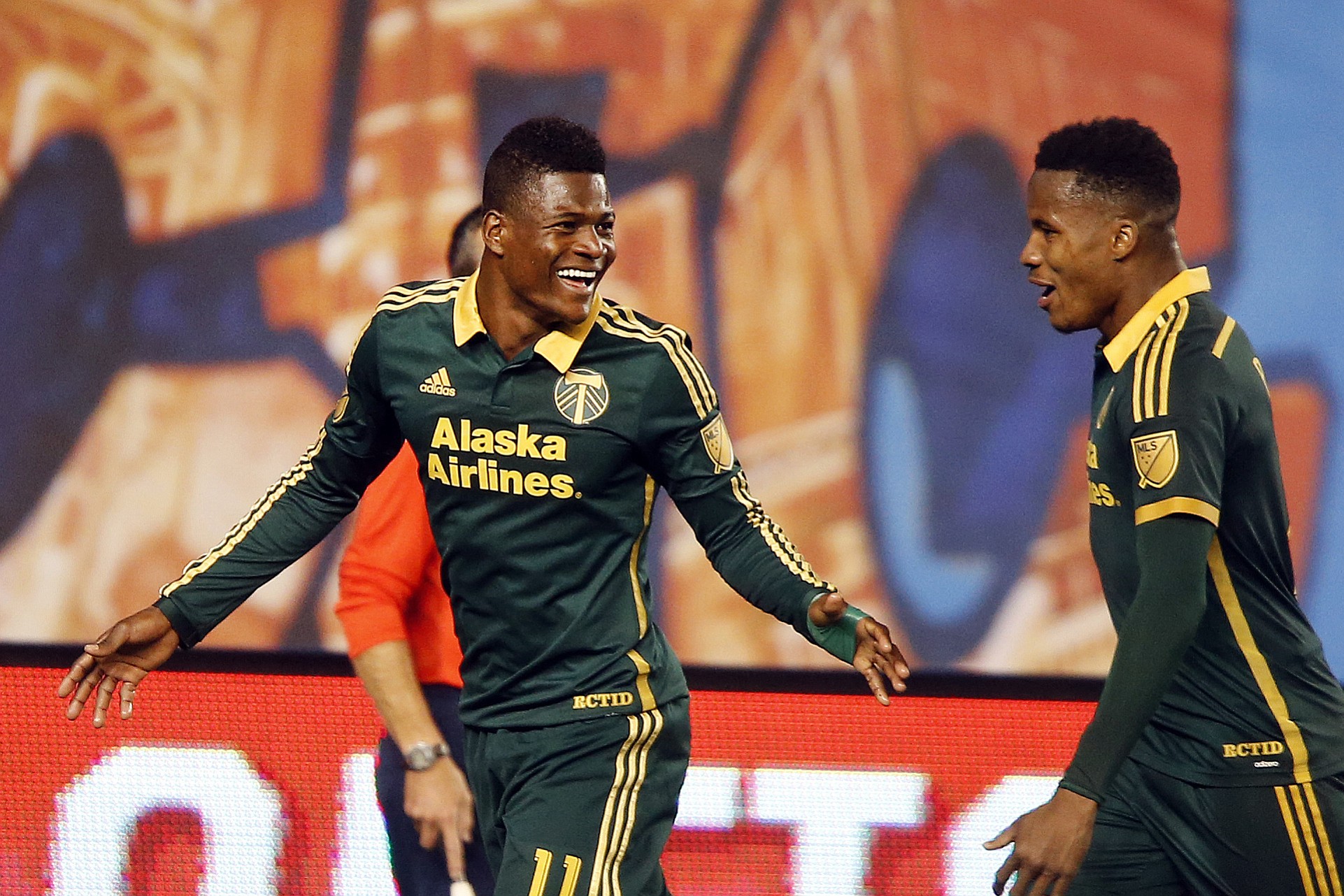 Portland Timbers' Dairon Asprilla (11), of Colombia, celebrates with teammate  Alvas Powell, of Jamaica, right, after scoring against New York City FC during an MLS soccer game at Yankee Stadium, Sunday, April 19, 2015, in New York.
