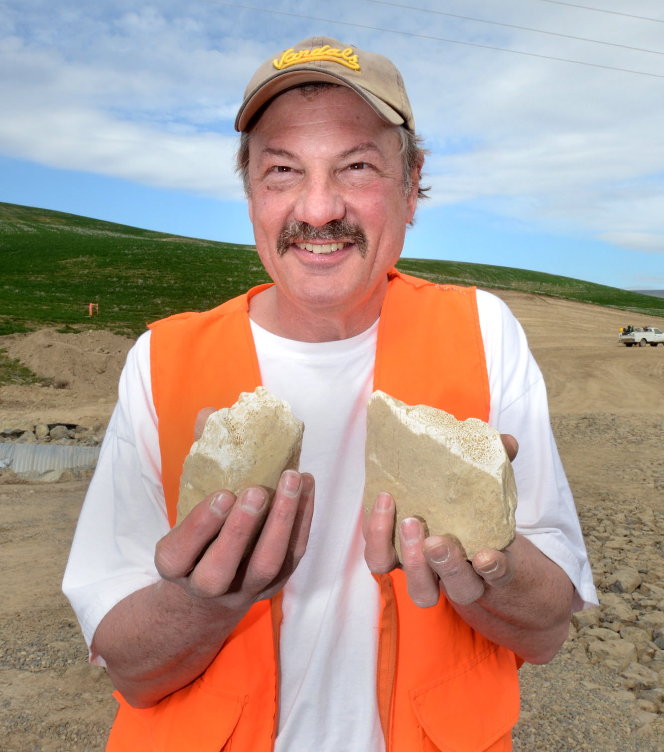 University of Idaho anthropologist Lee Sappington holds bones on March 19 that he has identified as possibly being bone fragments of a centuries-old mammoth discovered last week at the Port of Clarkston expansion site.