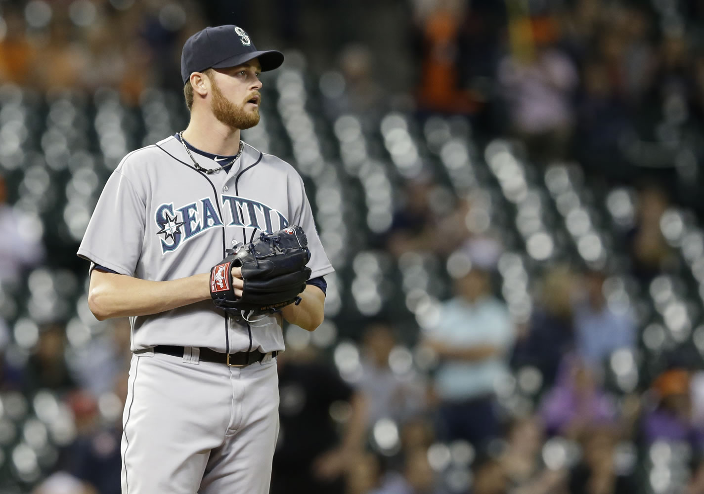 Seattle Mariners relief pitcher Charlie Furbush looks off to the outfield after loading the bases against the Houston Astros in the 11th inning Friday. The Astros won 5-4.
