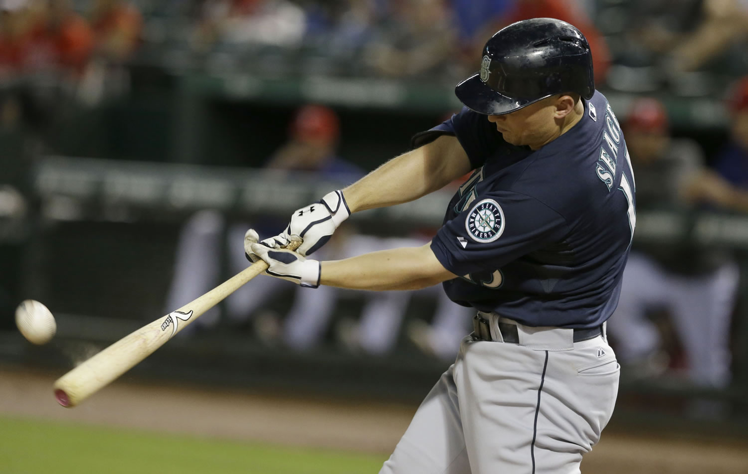Seattle Mariners Kyle Seager (15) hits fly out during the fourth inning against the Texas Rangers Saturday, Sept. 6, 2014, in Arlington, Texas.