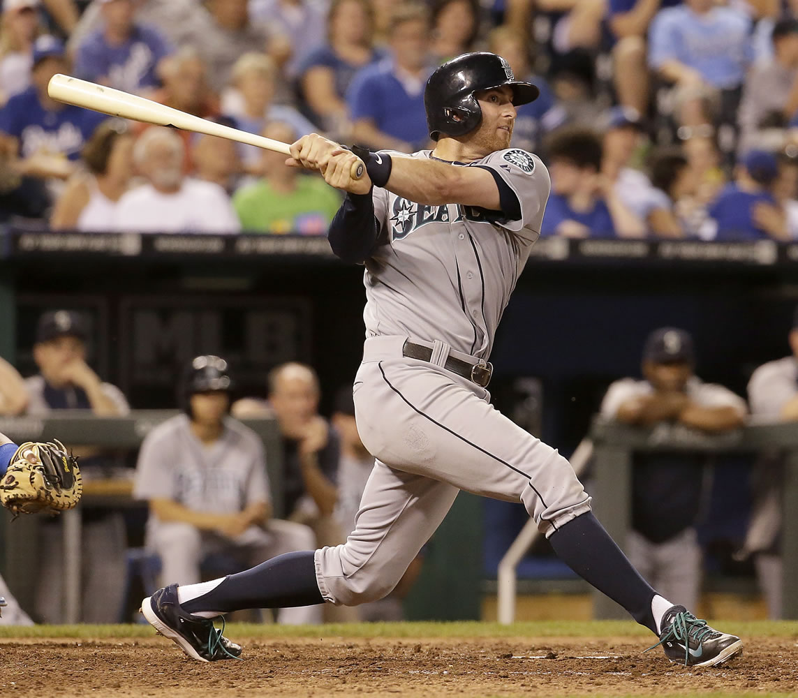 Seattle's Brad Miller hits a solo home run during the ninth inning against Kansas City  on Friday.