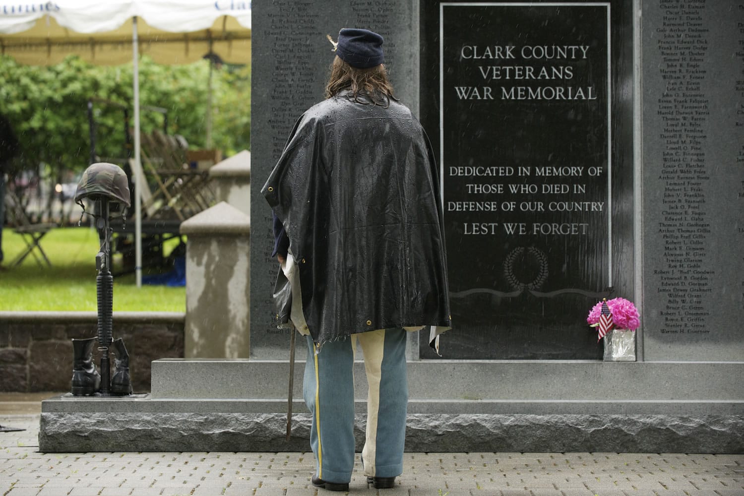Civil War re-enactor Emily Wattez reads names from the Clark County Veterans War Memorial before Vancouver's Memorial Day Observance at the Vancouver Barracks in 2013.