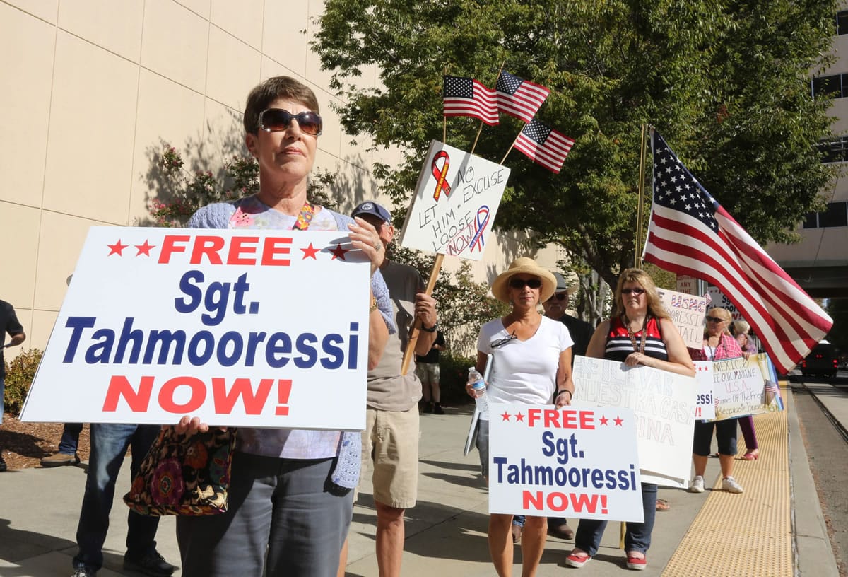 Bonnie McAdams joins others Tuesday, Aug. 26 calling for the release of Marine Andrew Tahmooressi, who was detained by the Mexican government for crossing the border with weapons, during a rally outside the Stanford Mansion where Mexican President Enrique Pena Nieto will appear with Gov.