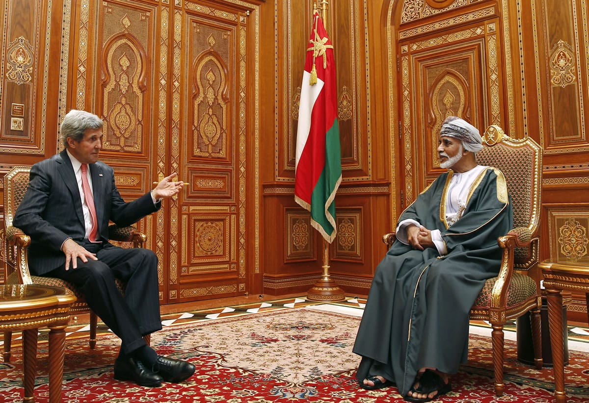 U.S. Secretary of State John Kerry, left, meets in May with Oman's Sultan Qaboos bin Said at Bait Al Baraka in Muscat, Oman. Oman's announcement on Sunday that it negotiated the release of foreign hostages held by Yemen's Shiite Houthi rebels is the most recent example of the unassuming sultanate wielding its influence as one of the Middle East's most useful mediators of thorny disputes.