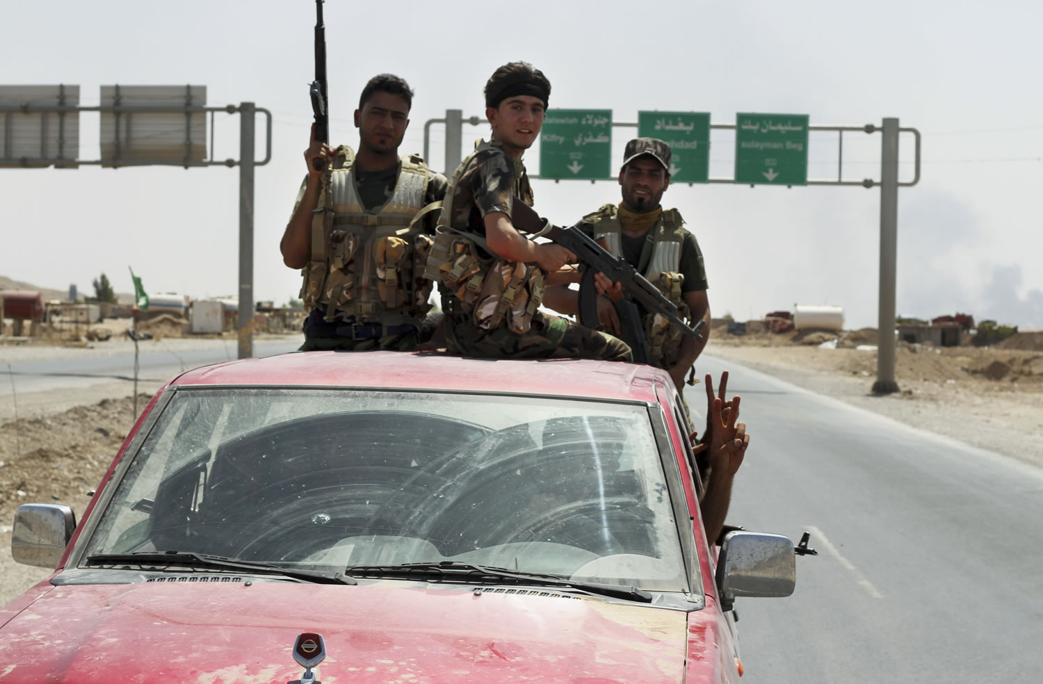 Shiite militiamen patrol in Amirli, Iraq, after breaking a siege by the Islamic State extremist group on the town, some 105 miles north of Baghdad, on Sunday. Iraqi security forces and Shiite militiamen on Sunday broke the six-week siege imposed by the Islamic State group on the northern Shiite Turkmen town of Amirli, following U.S.
