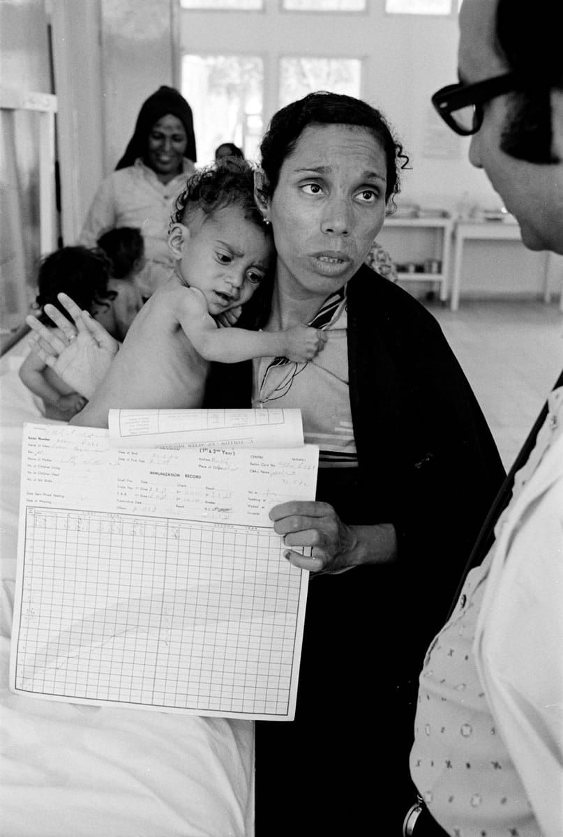 In this 1975 photo from the U.N. Relief and Works Agency, UNRWA, archive, Fathiyeh Sattari, a worried Palestinian mother talks to a doctor about her underweight child, Hassan, who is being treated at a Rafah health center run by the U.N. Relief and Works Agency, UNRWA. The photo is part of UNWRA's vast photo archive being digitized in Gaza and Denmark to preserve a record of one of the world's most entrenched refugee problems, created in what the Palestinians call the &quot;Nakba,&quot; or icatastrophei-- their uprooting in the war over Israel's 1948 creation.