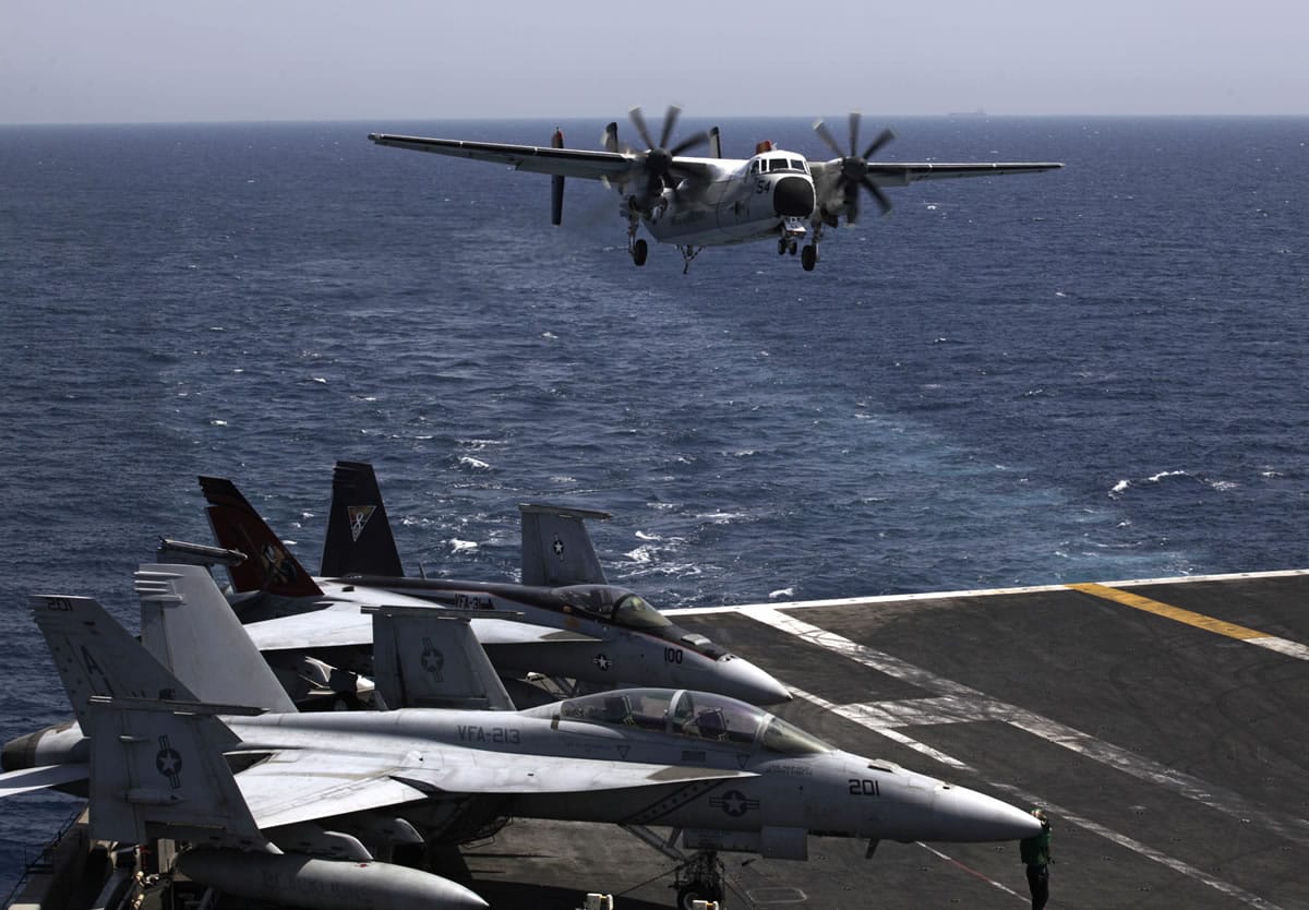 A U.S. military plane lands Aug. 11 on the Navy aircraft carrier USS George H.W. Bush in the Persian Gulf. The U.S.