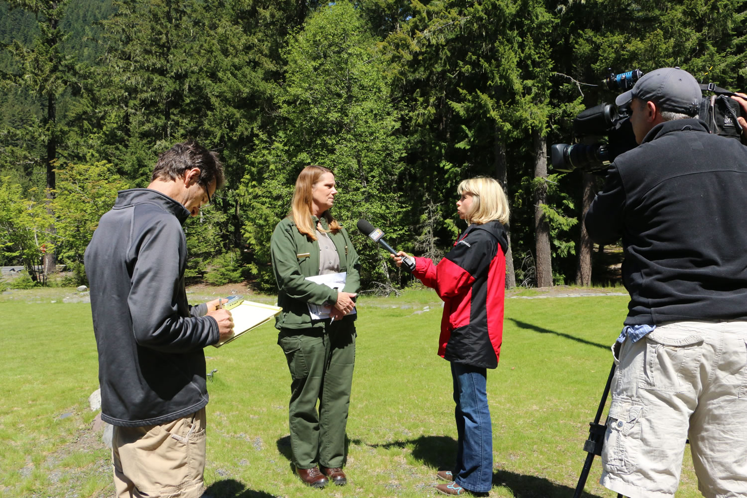 Mount Rainier National Park spokeswoman Patti Wold talks to the media outside of the park's headquarters on Sunday.