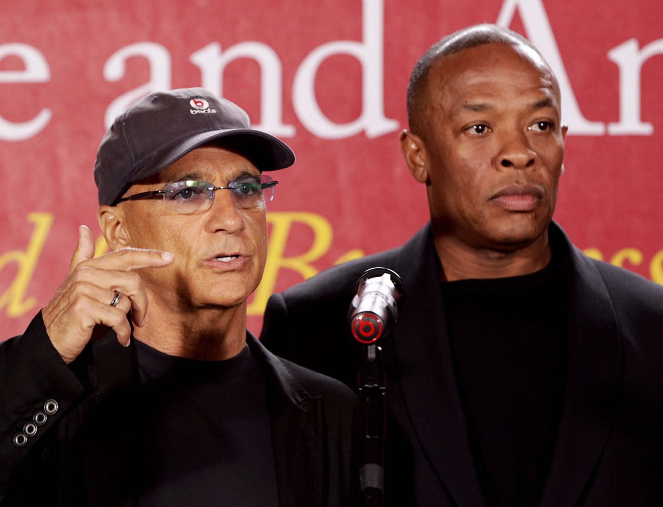 Interscope Records and Beats Electronics co-founder Jimmy Iovine, left, with hip-hop mogul and Beats Electronics co-founder Dr. Dre, as they announce May 15, 2013 a $70 million dollar donation to create the new &quot;Jimmy Iovine and Andre Young Academy for Arts and Technology and Business Innovation,&quot; during a news conference at in Santa Monica, Calif. Apple announced May 28 that it will acquire Beats Electronics and its music service, Beats Music, for $3 billion.