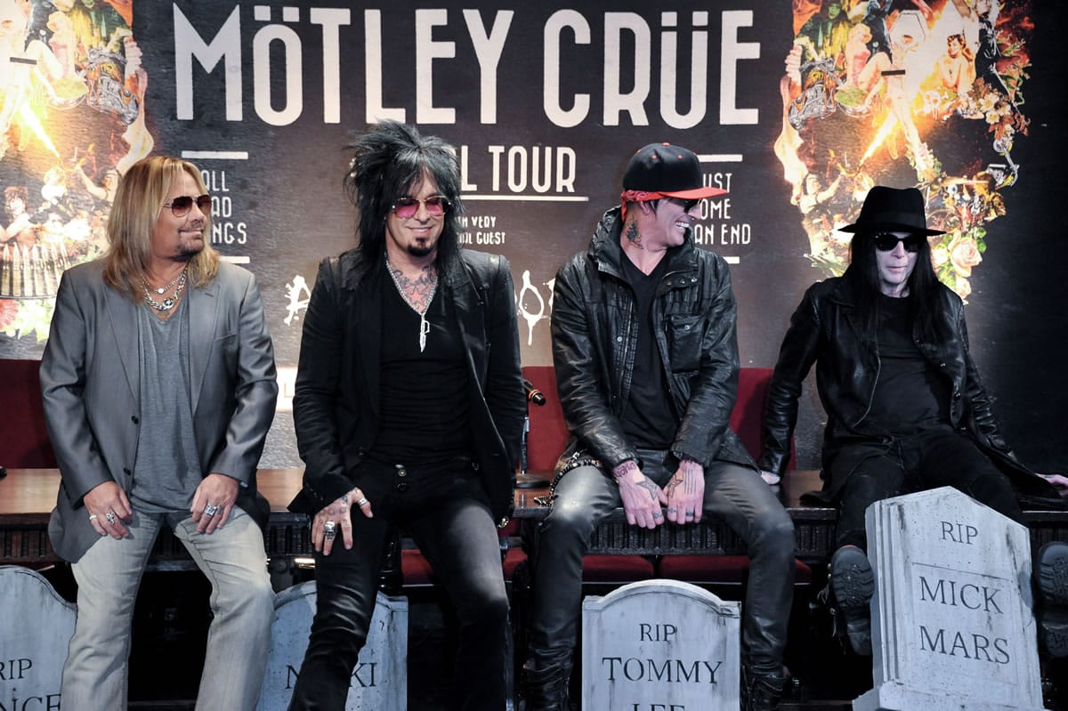 From left, Vince Neil, Nikki Sixx, Tommy Lee, and Mick Mars appear Tuesday, Jan. 28, 2014, in Los Angeles.