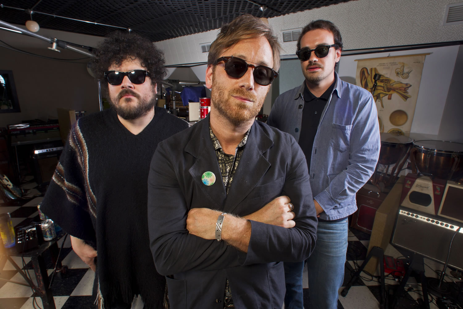 Dan Auerbach, center, Richard Swift, left, and Leon Michels pose Aug. 18 at Easy Eye Studio in Nashville, Tenn. Black Keys guitarist and singer Dan Auerbach brought together studio musicians with diverse backgrounds in rock, soul, Latin and country for his new band, The Arcs. Their debut album, "Yours, Dreamily"; out on Sept. 4, is a funky, synthesizer-heavy collection of garage rock songs as varied as the musicians involved.
