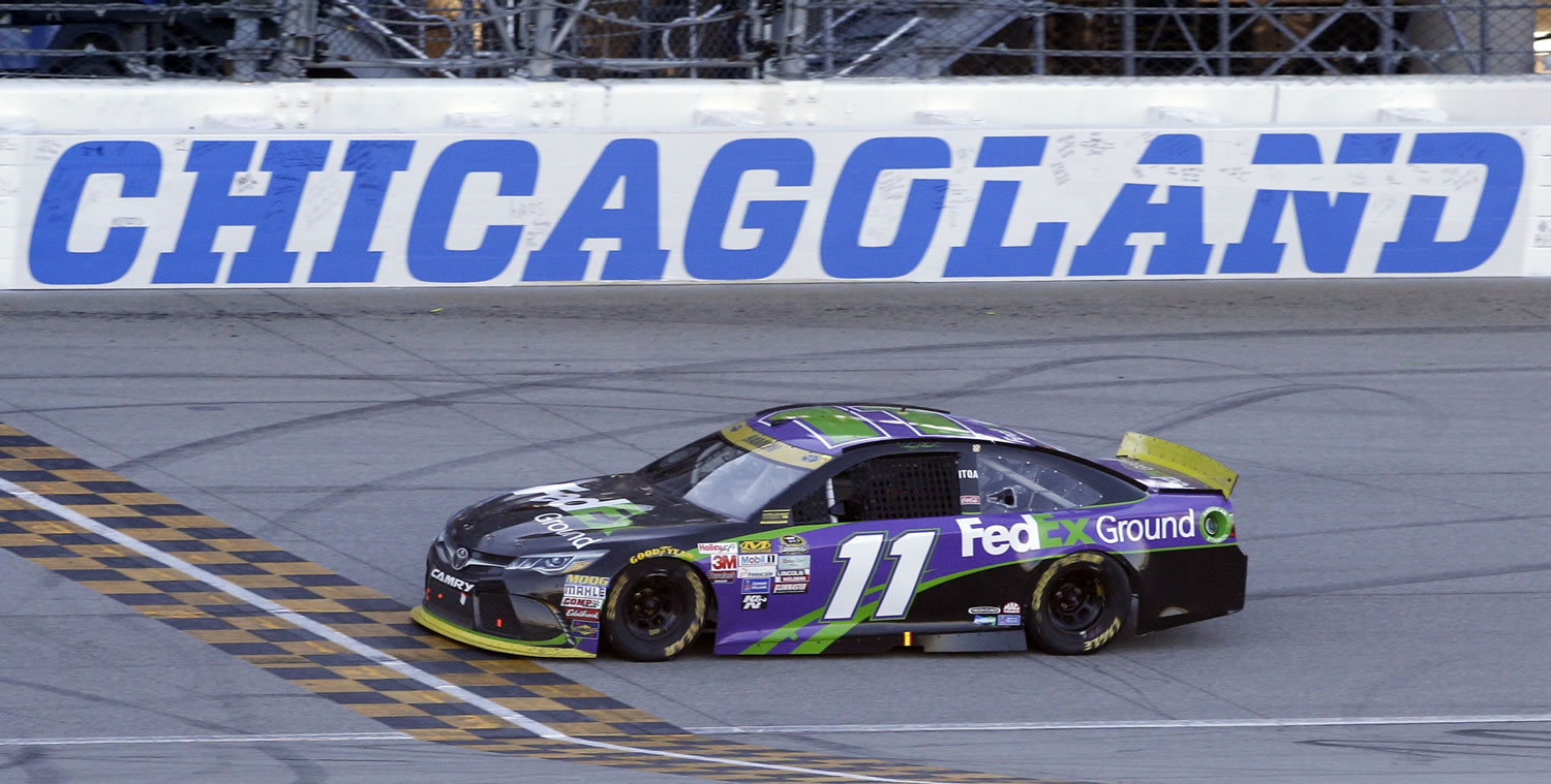 Denny Hamlin crosses the finish line as he wins the NASCAR Sprint Cup race at Chicagoland Speedway, Sunday, Sept. 20, 2015, in Joliet, Ill. (AP Photo/Nam Y.