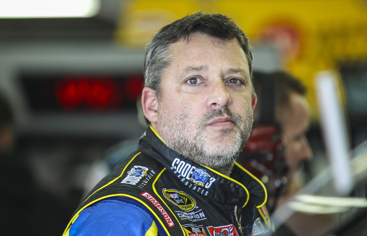 Driver Tony Stewart waits in the garage while his car is worked on during practice for the Sunday's NASCAR Sprint Cup series auto race at New Hampshire Motor Speedway in Loudon, N.H., Friday, Sept.
