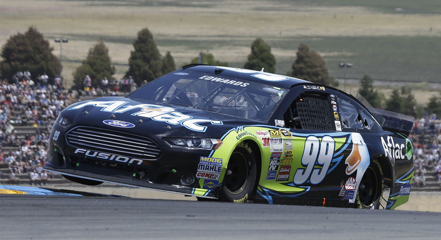 Carl Edwards competes during the NASCAR Sprint Cup Series auto race on Sunday, June 22, 2014, in Sonoma, Calif.