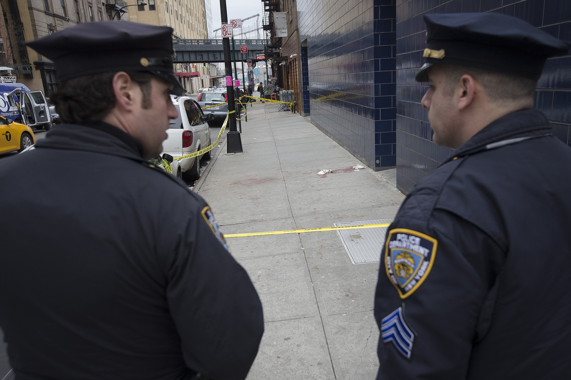 Police officers stand guard Wednesday near 1 Oak nightclub on West 20th Street in New York where authorities say Indiana Pacers forward Chris Copeland, his wife and another woman were stabbed outside after an argument in New York.