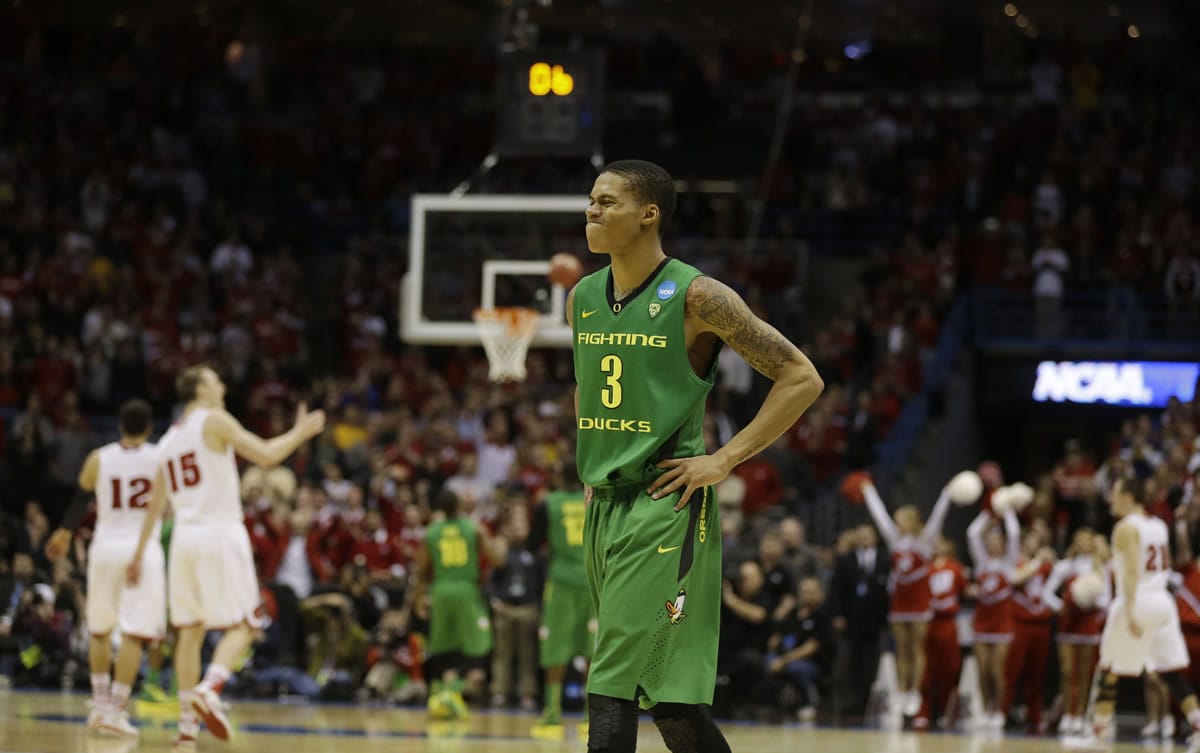 Oregon guard Joseph Young (3) reacts during the second half of a third-round game against the Wisconsin in the NCAA college basketball tournament Saturday, March 22, 2014, in Milwaukee. Wisconsin won 82-77.