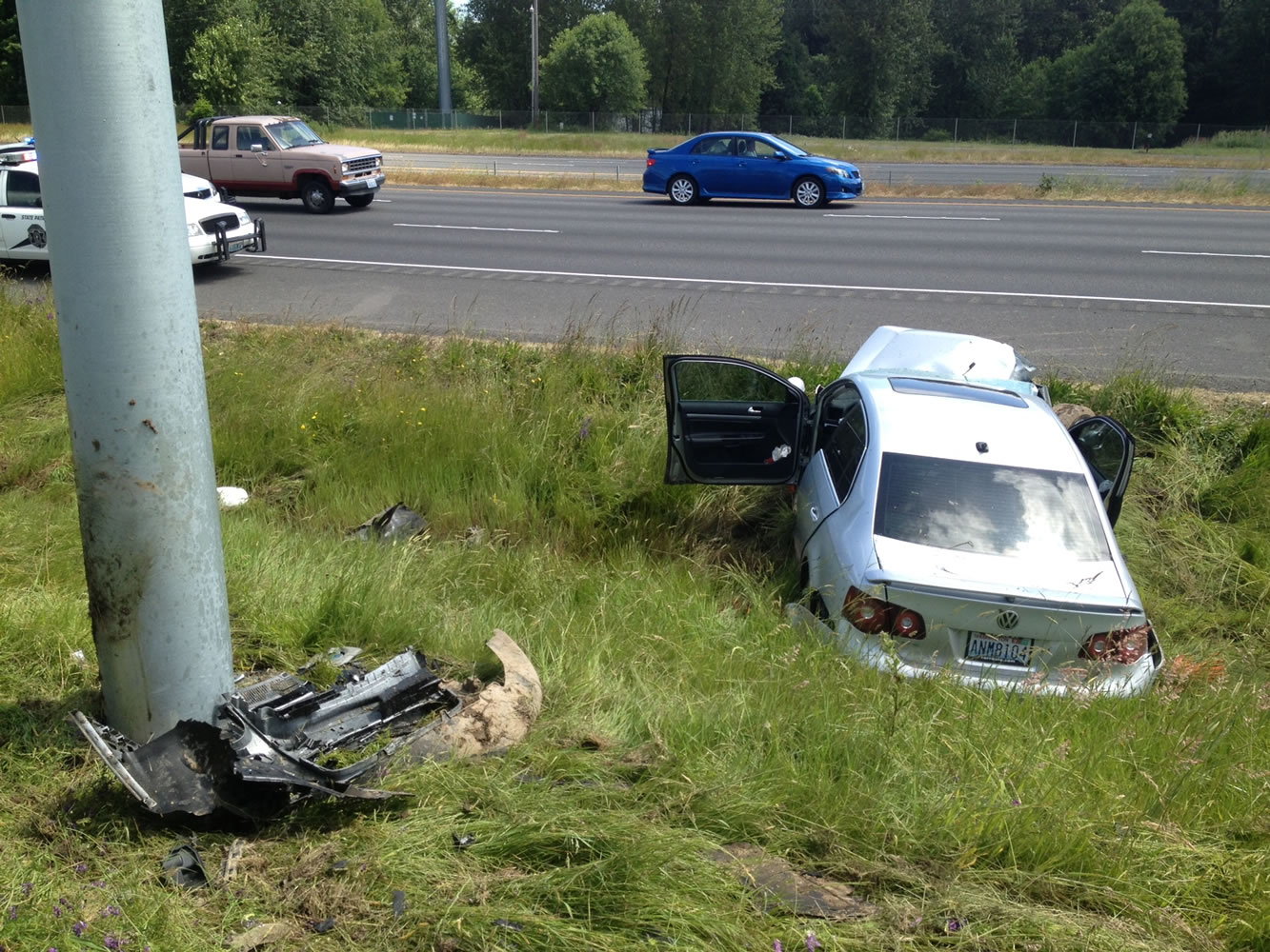 A man was killed and two children injured Saturday when their car went off Interstate 5 near Ridgefield.