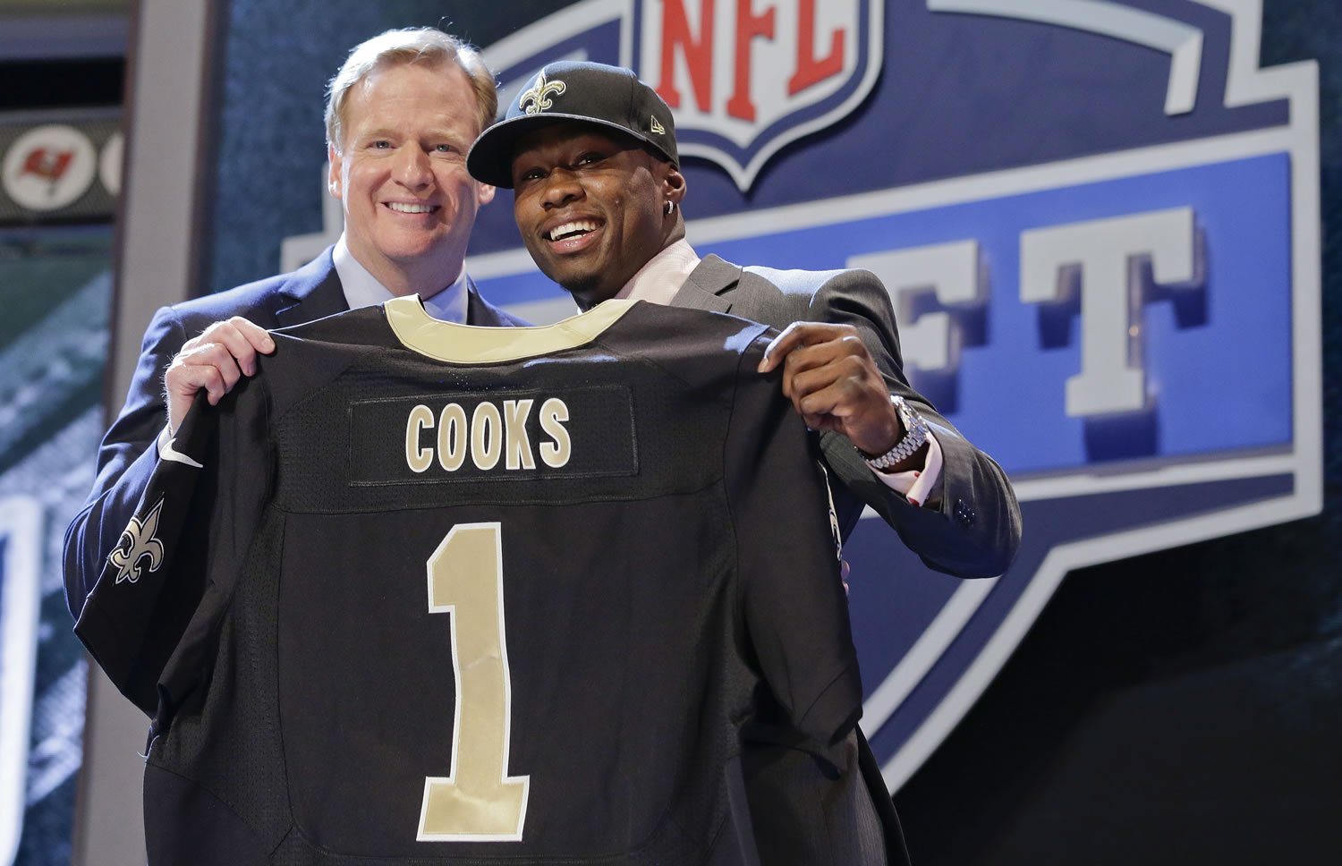 Oregon State wide receiver Brandon Cooks poses with NFL commissioner Roger Goodell after being selected by the New Orleans Saints as the 20th pick the first round of the 2014 NFL Draft, Thursday.