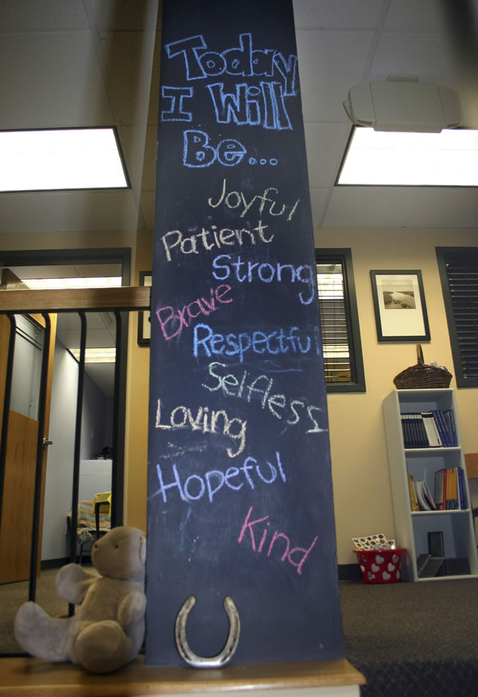 In this Sept. 23 photo provided by the Resiliency Center of Newtown, a chalk board painted column is displayed at the center in Newtown, Conn.