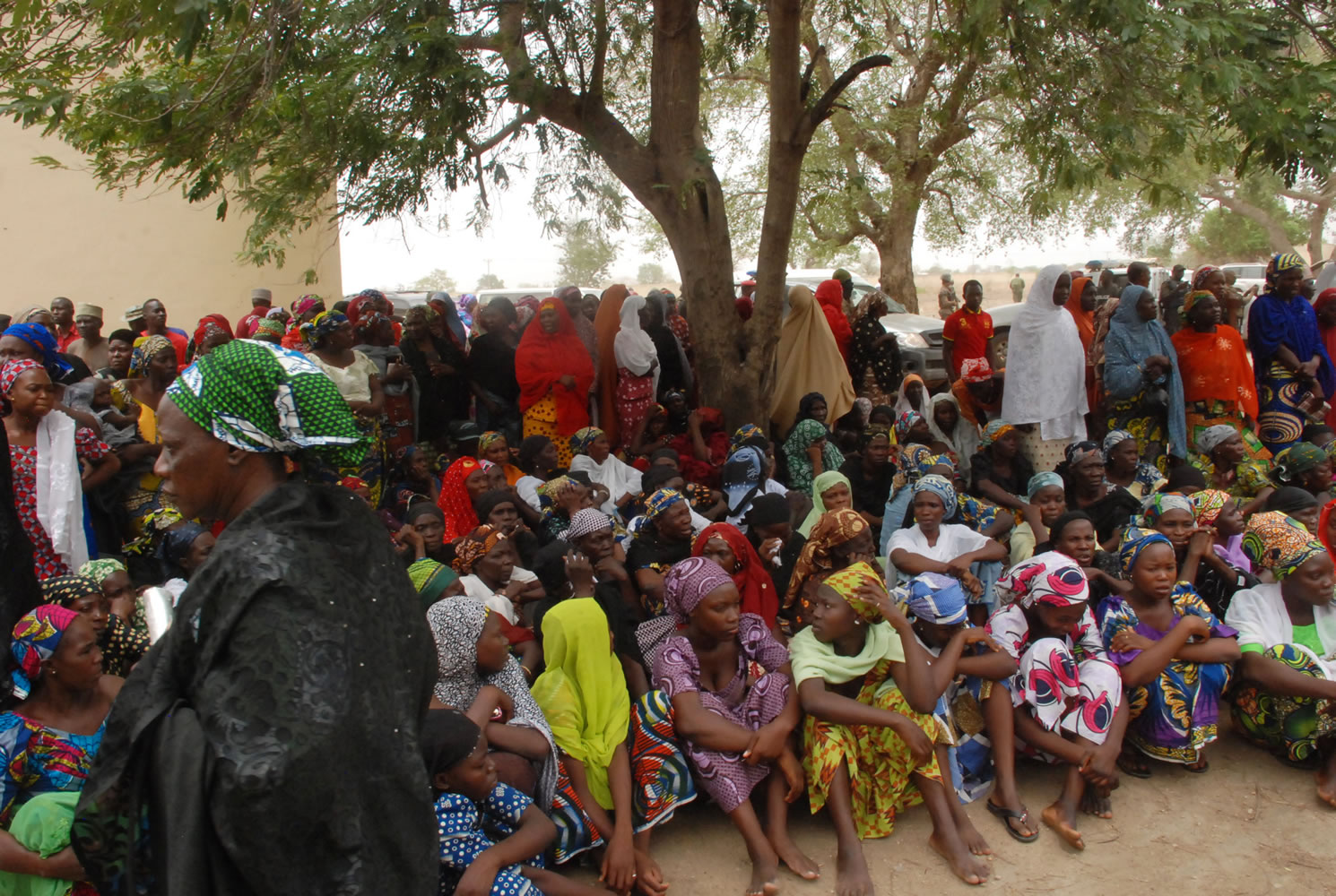 Associated Press
Mothers and some of the kidnapped school girls from the government secondary school Chibok, who managed to escape, gather Monday under a tree prior to the visit of Nana Shettima, the wife of Borno Gov. Kashim Shettima, in Chibok, Nigeria.