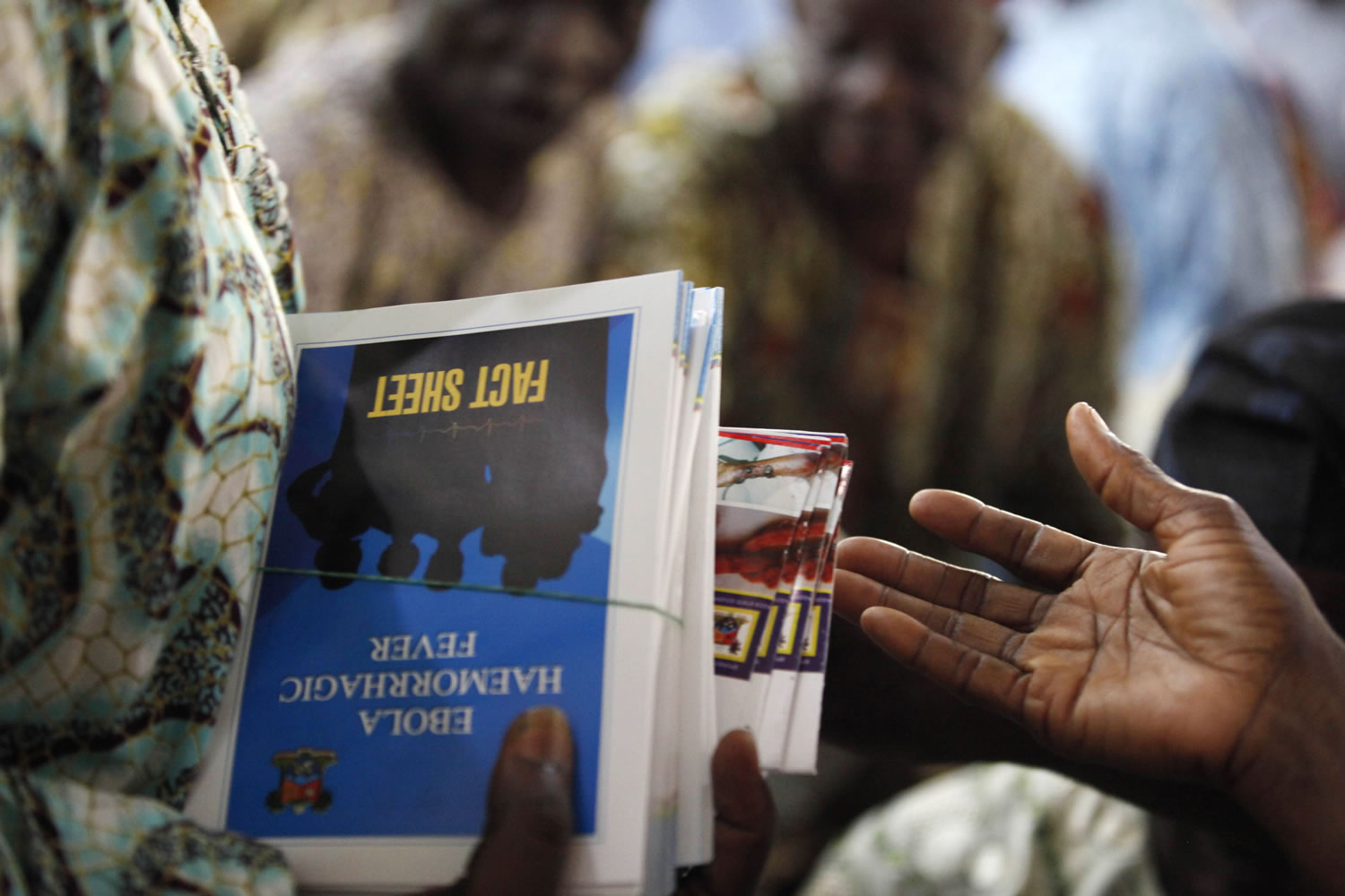Fact sheets about the Ebola virus are distributed during an awareness campaign Friday in Lagos, Nigeria.