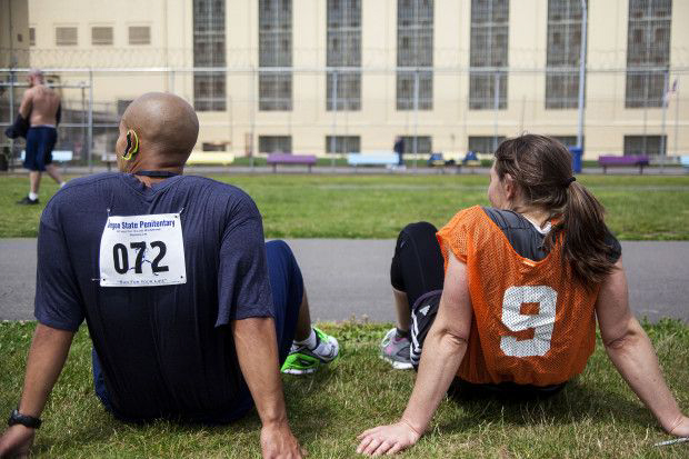 Kayla Moothart sits with an inmate after the race.