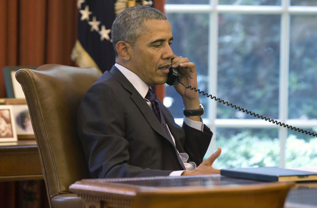 President Barack Obama speaks on the phone Monday in the Oval Office of the White House during a conference call hosted by the American Lung Association and other public health groups to discuss new common-sense steps to reduce carbon pollution from power plants.