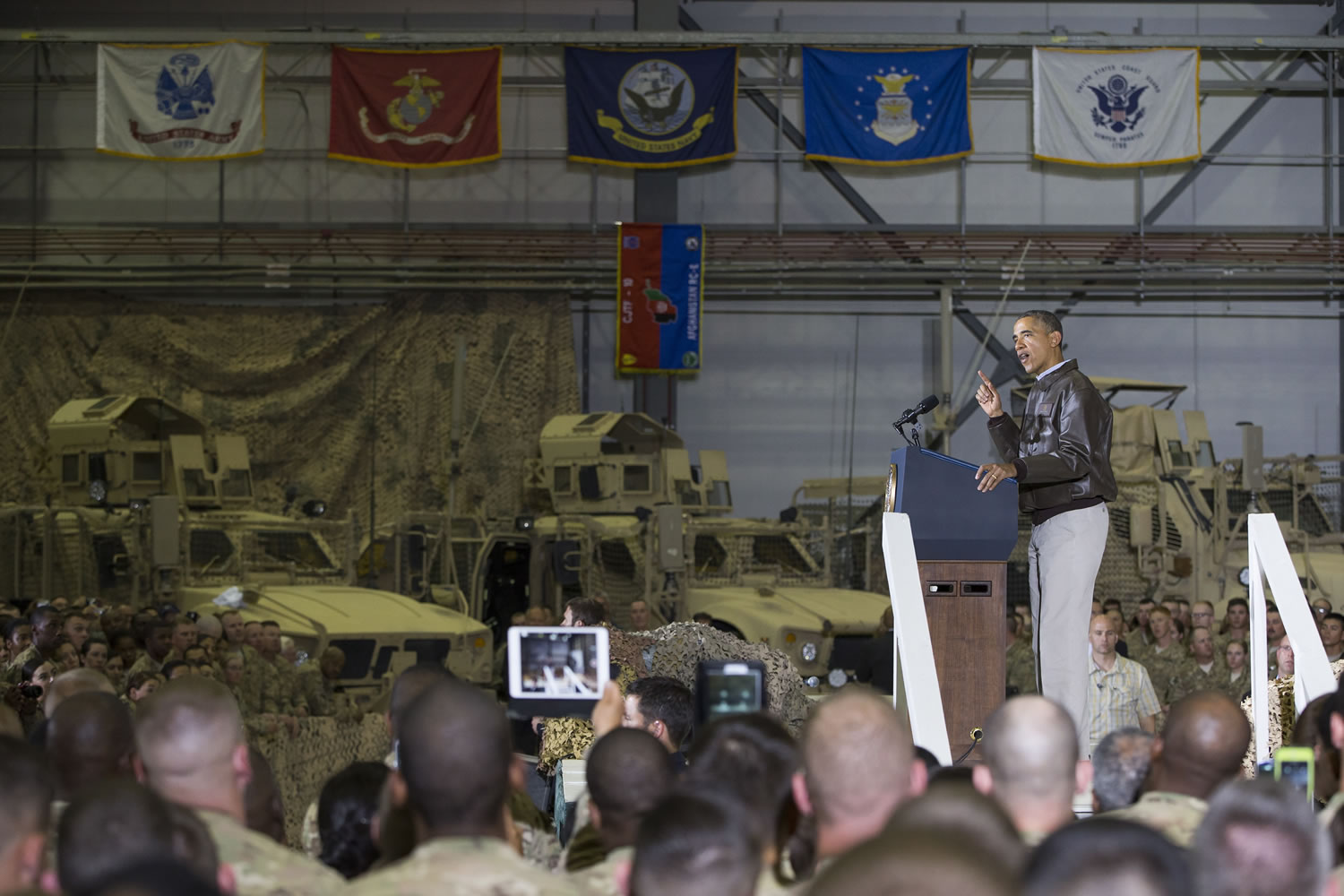 President Barack Obama gestures as he speaks to troops at Bagram Air Field north of Kabul, Afghanistan during an unannounced visit, on Sunday.
