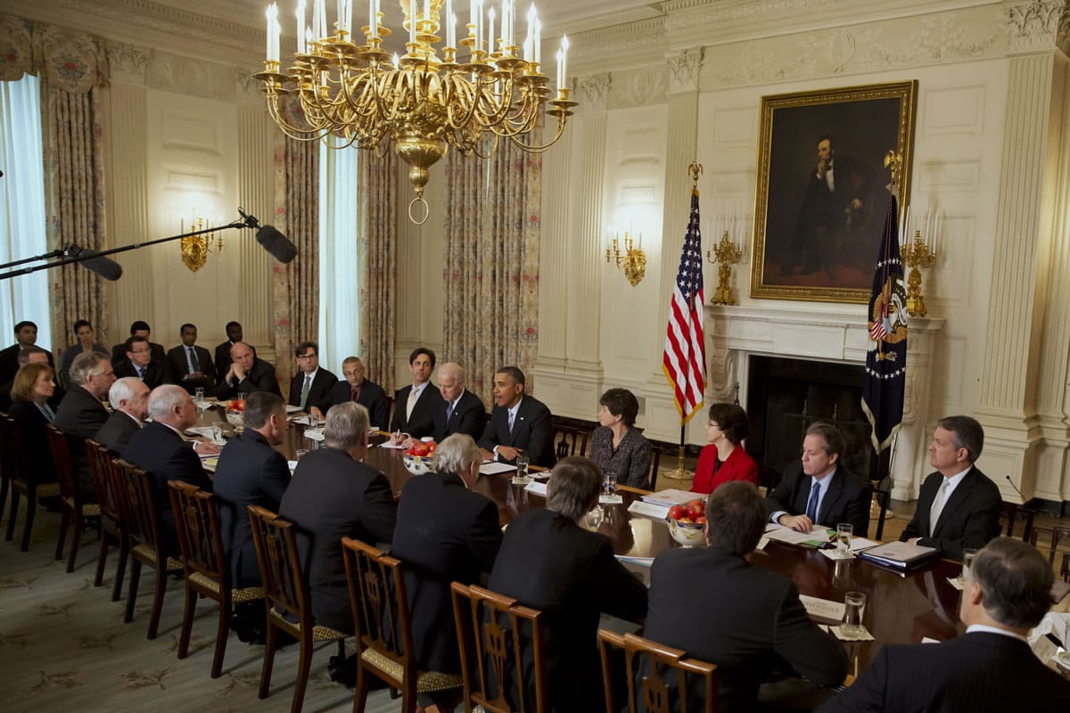 President Barack Obama, Vice President Joe Biden, White House Senior Adviser Valerie Jarrett and others meet with members of the Democratic Governors Association on Friday in the State Dining Room of the White House.