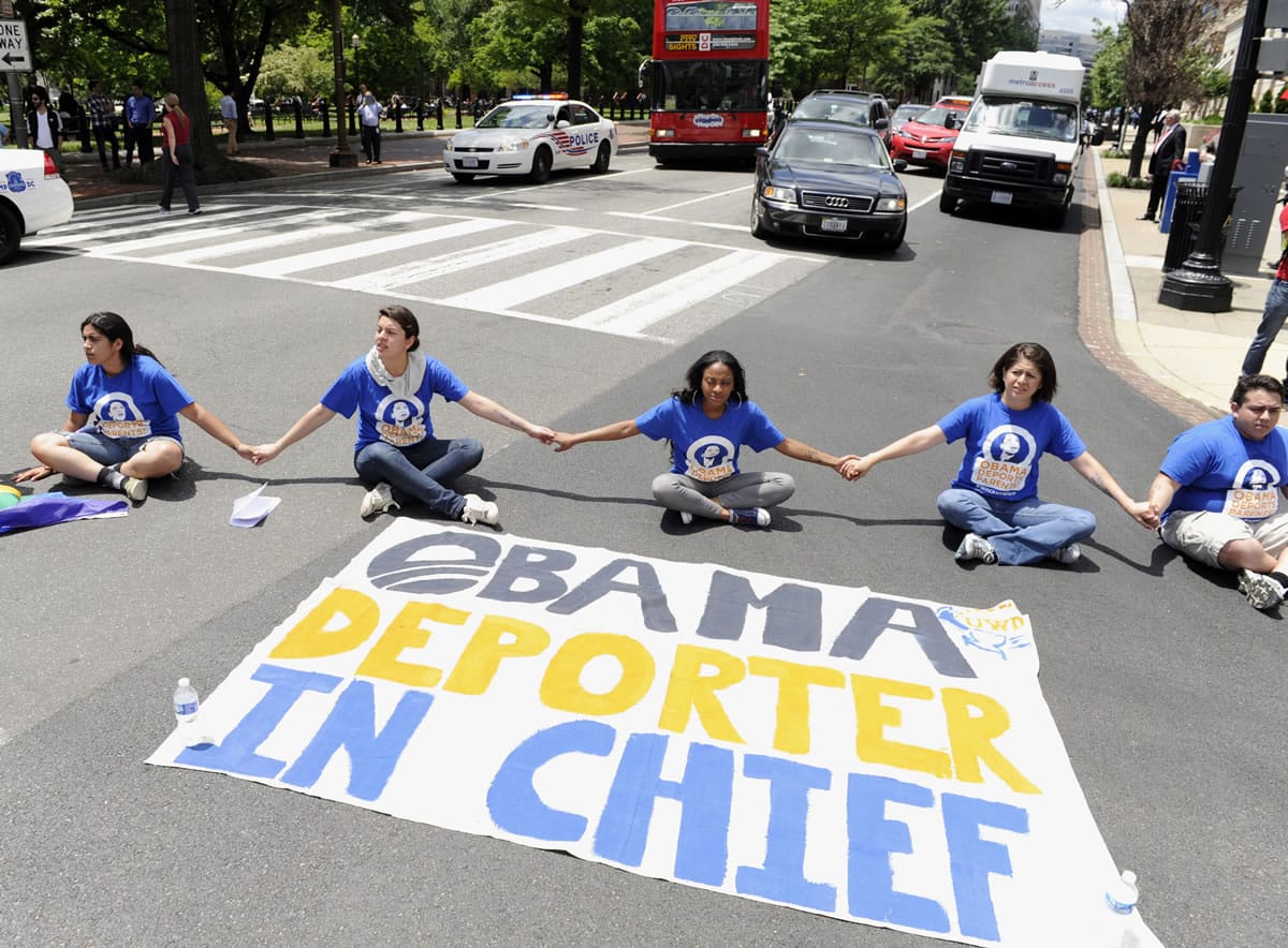 Associated Press files
Protestors block traffic near the White House in Washington on June 5 in response to President Obama's decision to delay the deportation review he ordered from the Department of Homeland Security.
