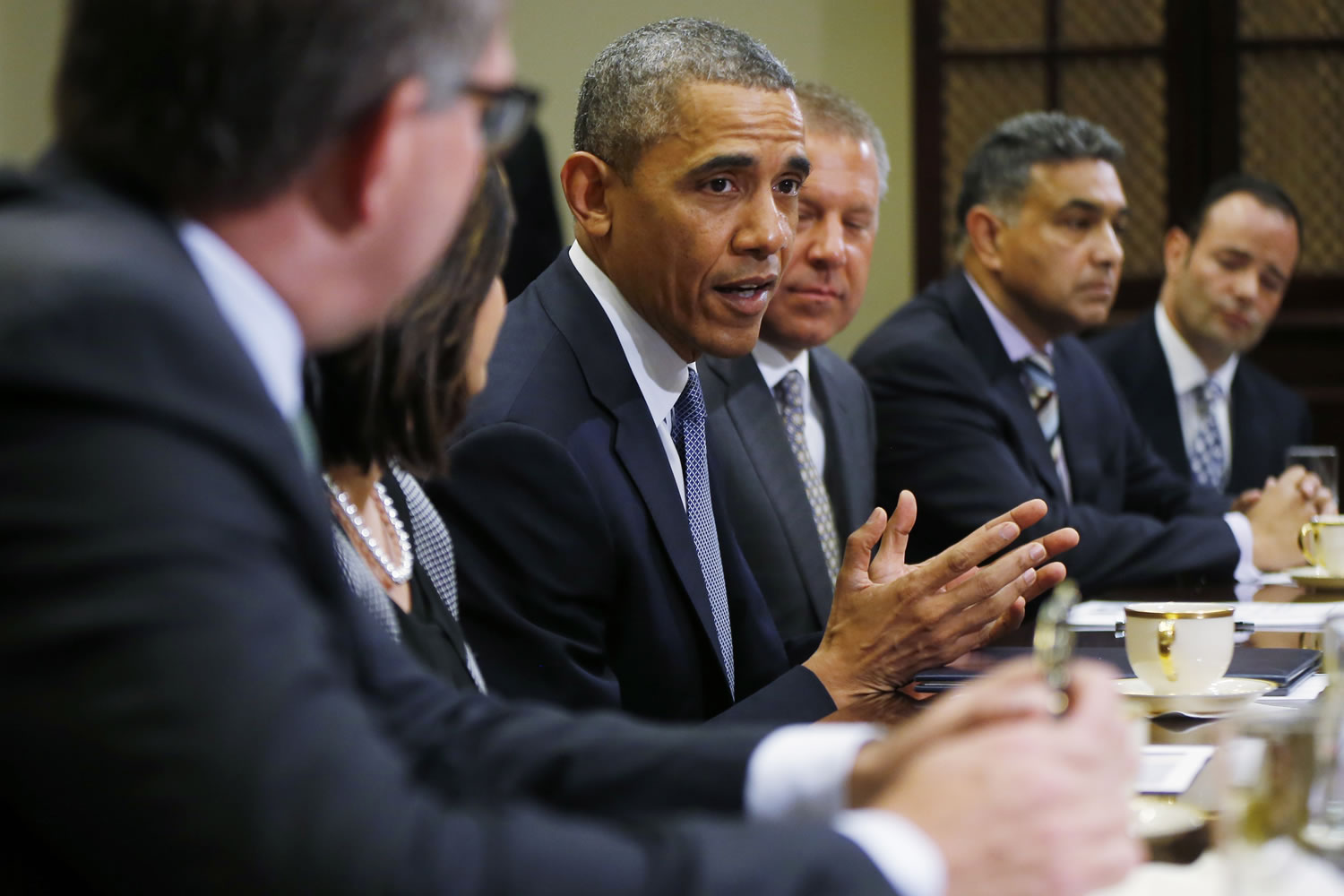 President Barack Obama meets with business leaders about creating and investing in jobs in the U.S. Tuesday, in the Roosevelt Room of the White House in Washington. From left are: Carsten Spohr, chairman and CEO, Deutsche Lufthansa AG; Ravila Gupta, president, Umicore USA; the president; Joe Hinrichs, executive vice president and president of the Americas, Ford Motor Company; Sanjay K.