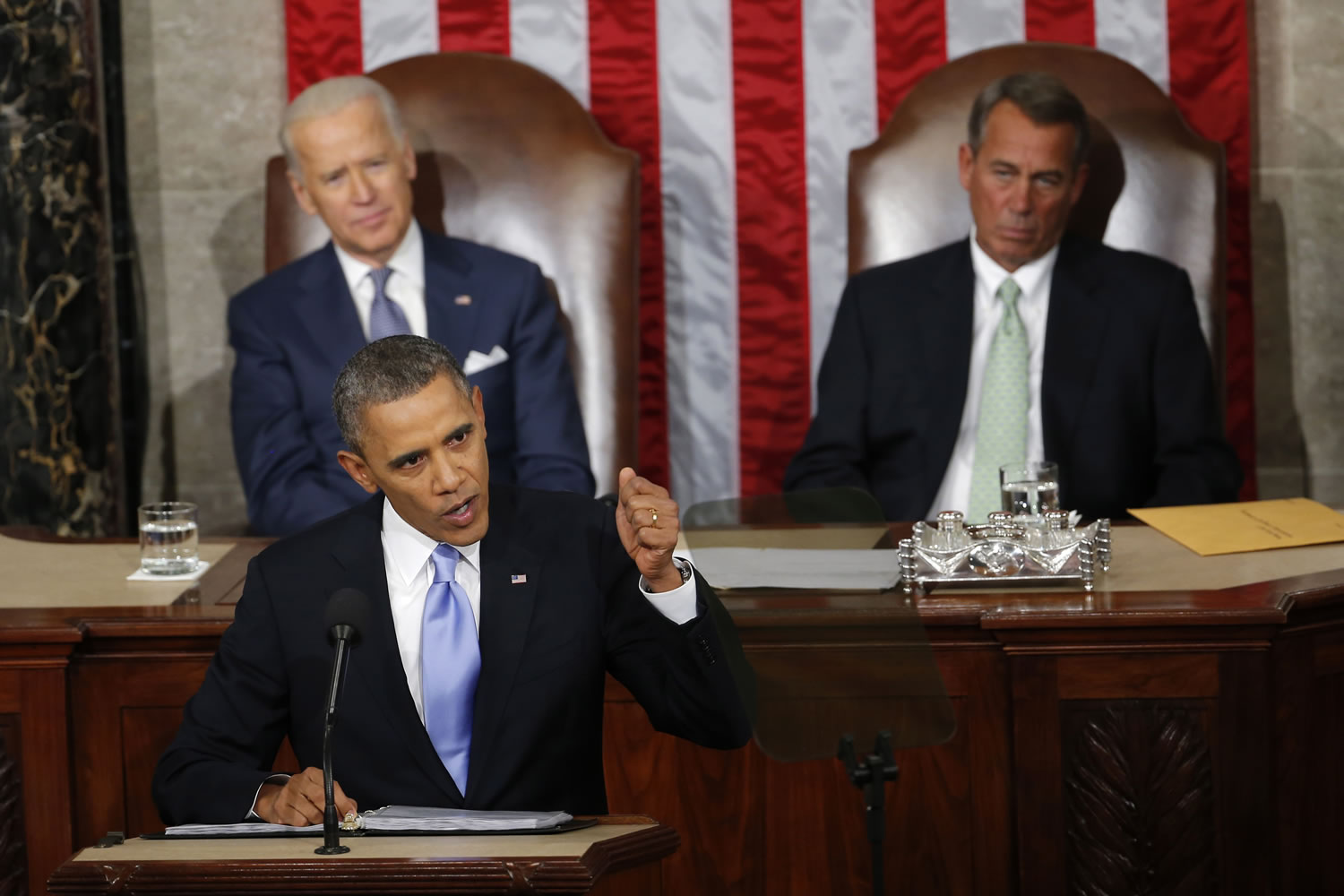 Vice President Joe Biden and House Speaker John Boehner of Ohio listens as President Barack Obama gives his State of the Union address on Capitol Hill in Washington.