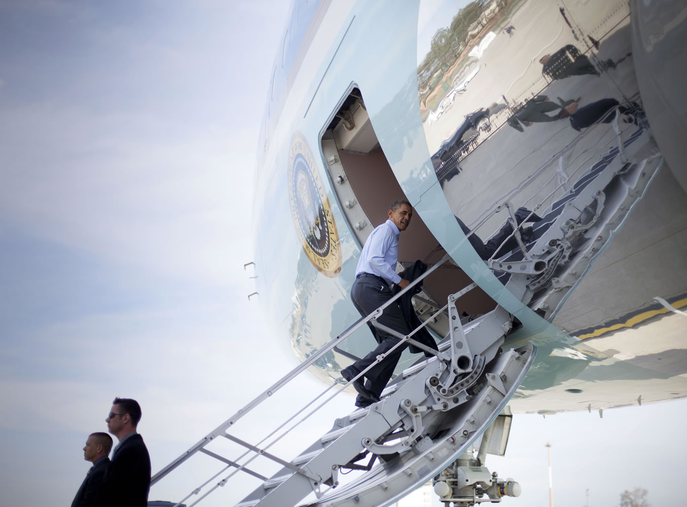 President Barack Obama boards Air Force One on Saturday at Ramstein Air Base in Germany. Air Force One was making a refueling stop and Obama used the opportunity to meet with members of the U.S.