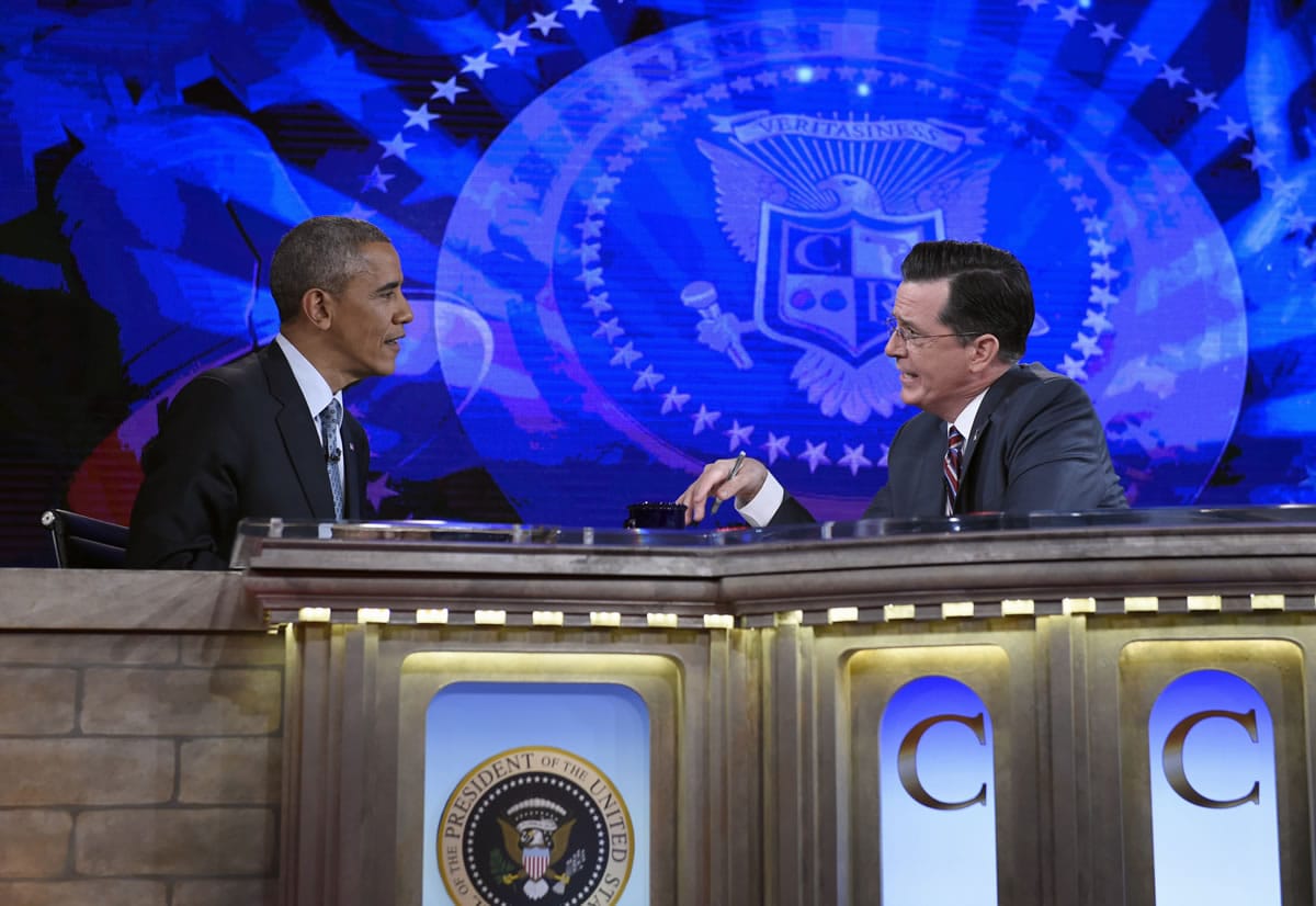 President Barack Obama talks early this month with Stephen Colbert of &quot;The Colbert Report&quot; during a taping of the program in Lisner Auditorium at George Washington University in Washington.