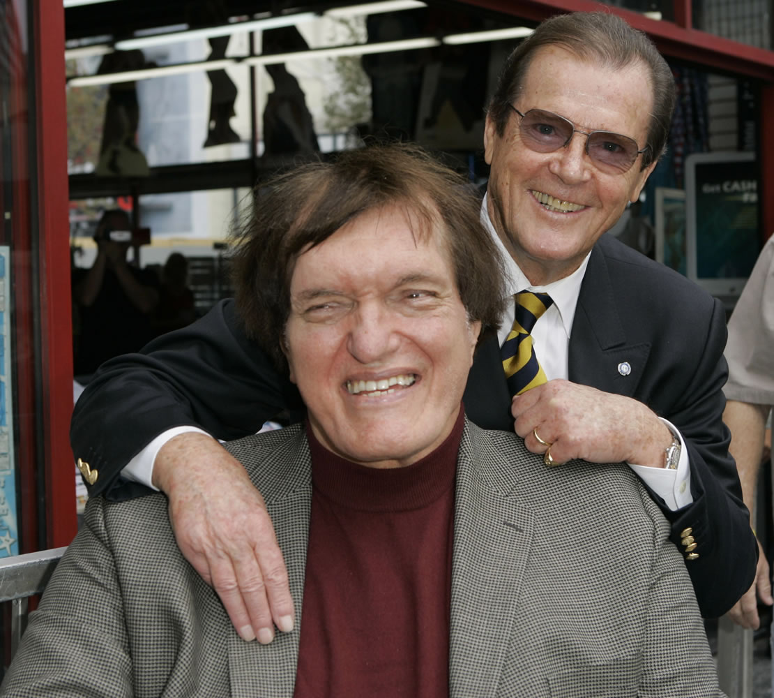 Actor Roger Moore, right, who played the part of James Bond 007 in seven films, poses Oct. 11, 2007 with actor Richard Kiel, who played the role of Jaws in &quot;The Spy Who Loved Me,&quot; during a ceremony honoring Moore with a star on the Hollywood Walk of Fame in Los Angeles. Kiel, the 7-foot-2-inch performer famously played the cable-chomping henchman who tussled with Moore's Bond in &quot;The Spy Who Loved Me&quot; and &quot;Moonraker,&quot; has died. He was 74. (AP Photo/Mark J.