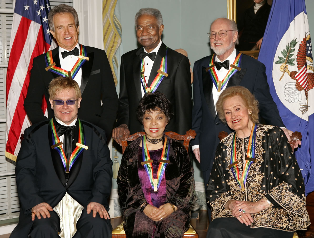 Recipients of the 27th annual Kennedy Center Honors, front, from left, singer and composer Elton John, actress Ruby Dee, and soprano Joan Sutherland; and, rear, from left, actor, producer, writer and director Warren Beatty, actor, writer and producer Ossie Davis, and composer and conductor John Williams, pose for a group photo following the 2004 dinner celebrating their lifetime achievements in the arts, at the State Department in Washington.