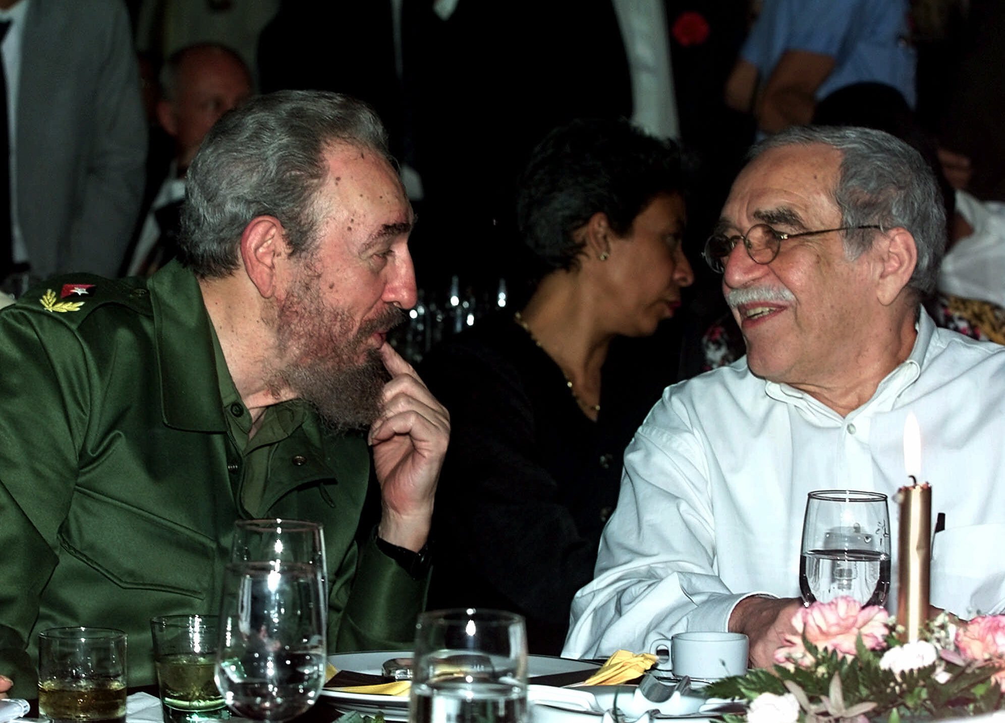 Cuba's leader Fidel Castro, left, and Colombian Nobel laureate Gabriel Garcia Marquez speak during a March 3, 2000 dinner at the annual cigar festival in Havana, Cuba.