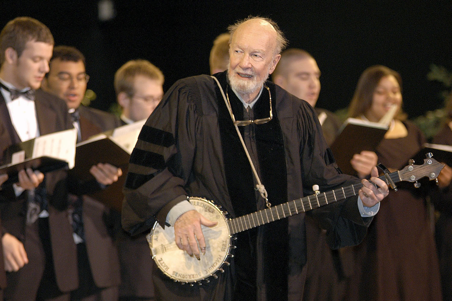 File-This May 10, 2003 file photo shows folk singer Pete Seeger performing&quot;When the Saints Go Marching In&quot; with the Saint Rose Chamber Singers during commencement ceremonies for the College of St. Rose at the Empire State Plaza in Albany, N.Y.   The American troubadour, folk singer and activist Seeger  died Monday Jan. 27, 2014, at age 94.