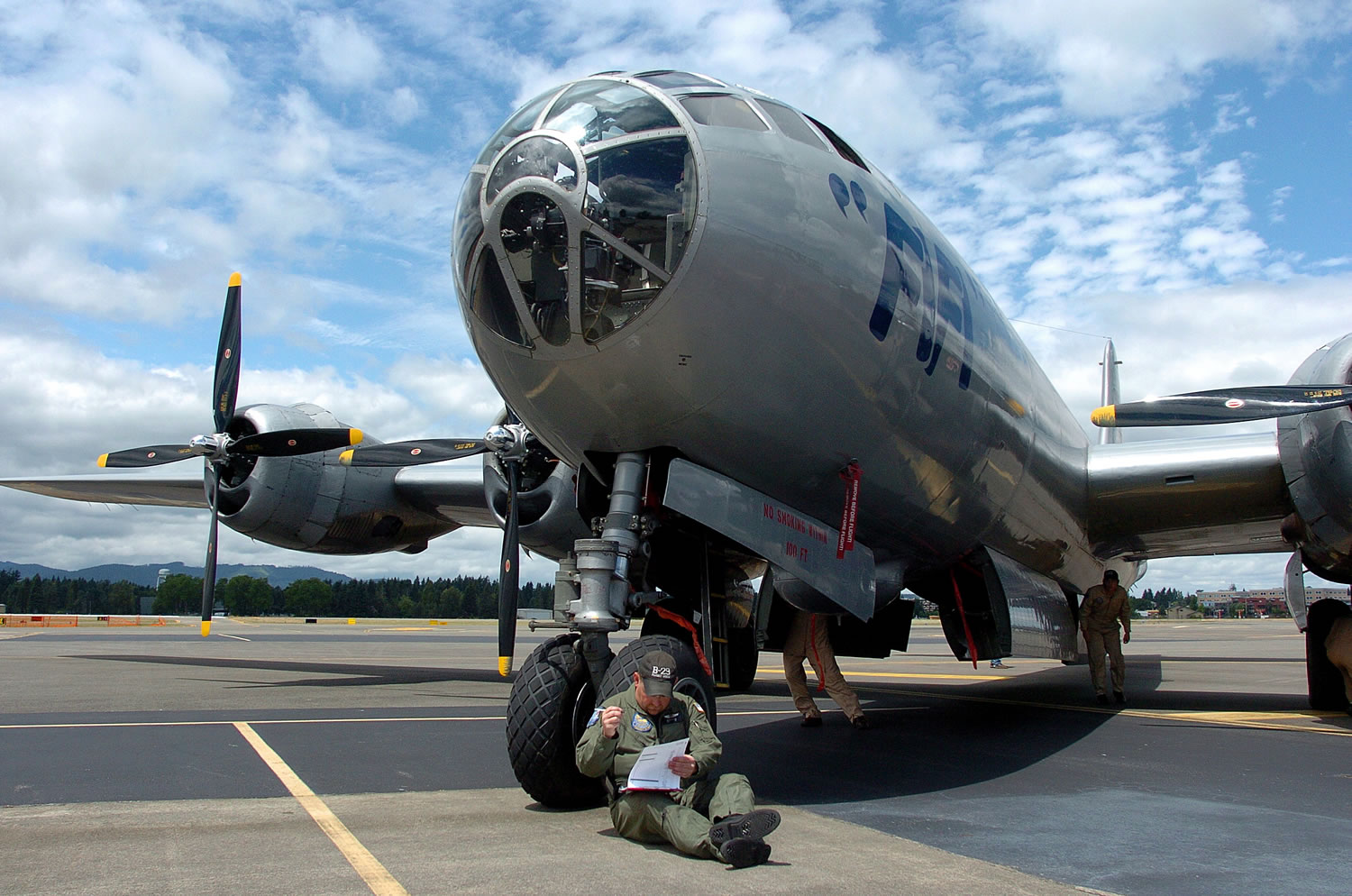 Flight crew member and Commemorative Air Force Col. Brad Pilgrim makes some notations  after &quot;Fifi,&quot; World War Two-era Boeing B-29 bomber operated by the Commemorative Air Force, arrived at the Olympic Flight Museum in Olympia,Wash., Thursday, June 12, 2014, for the museum's annual air show.