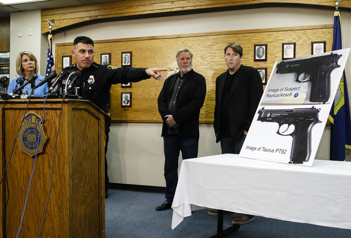 Omaha Police Chief Todd Schmaderer, second left, points to an enlargement of an airsoft pistol used in the robbery of a Wendy's restaurant on Tuesday, during a Wednesday, Aug. 27 news conference at police headquarters in Omaha, Neb. Police who opened fire while disrupting a robbery at a fast-food restaurant struck and killed Bryce Dion, a crew member with the long-running &quot;Cops&quot; television show and the suspect, who was carrying a pellet gun, authorities said Wednesday.