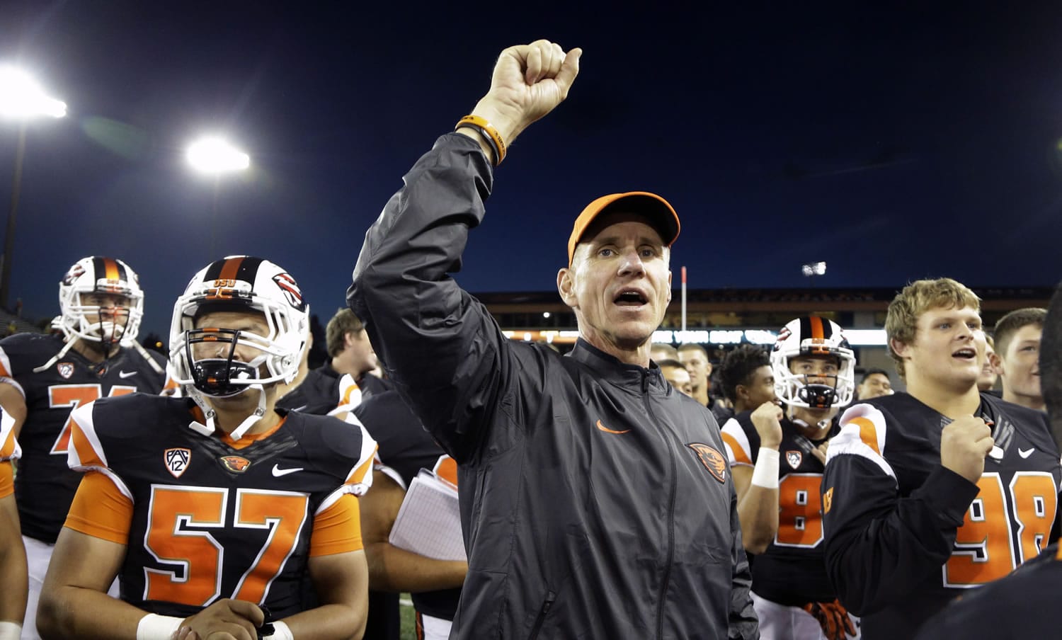 FILE - In this Friday, Sept. 4, 2015 file photo, Oregon State football coach Gary Anderson celebrates a  26-7 win over Weber State after an NCAA college football game in Corvallis, Ore.  With a young team, a true freshman quarterback, and a new scheme on both offense and defense, the first-year Oregon State coach had figured there would be growing pains.