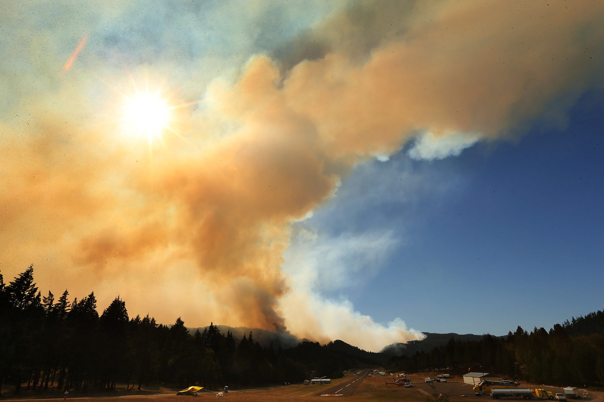 A large plume of smoke rises over the town of Oakridge Ore,.
