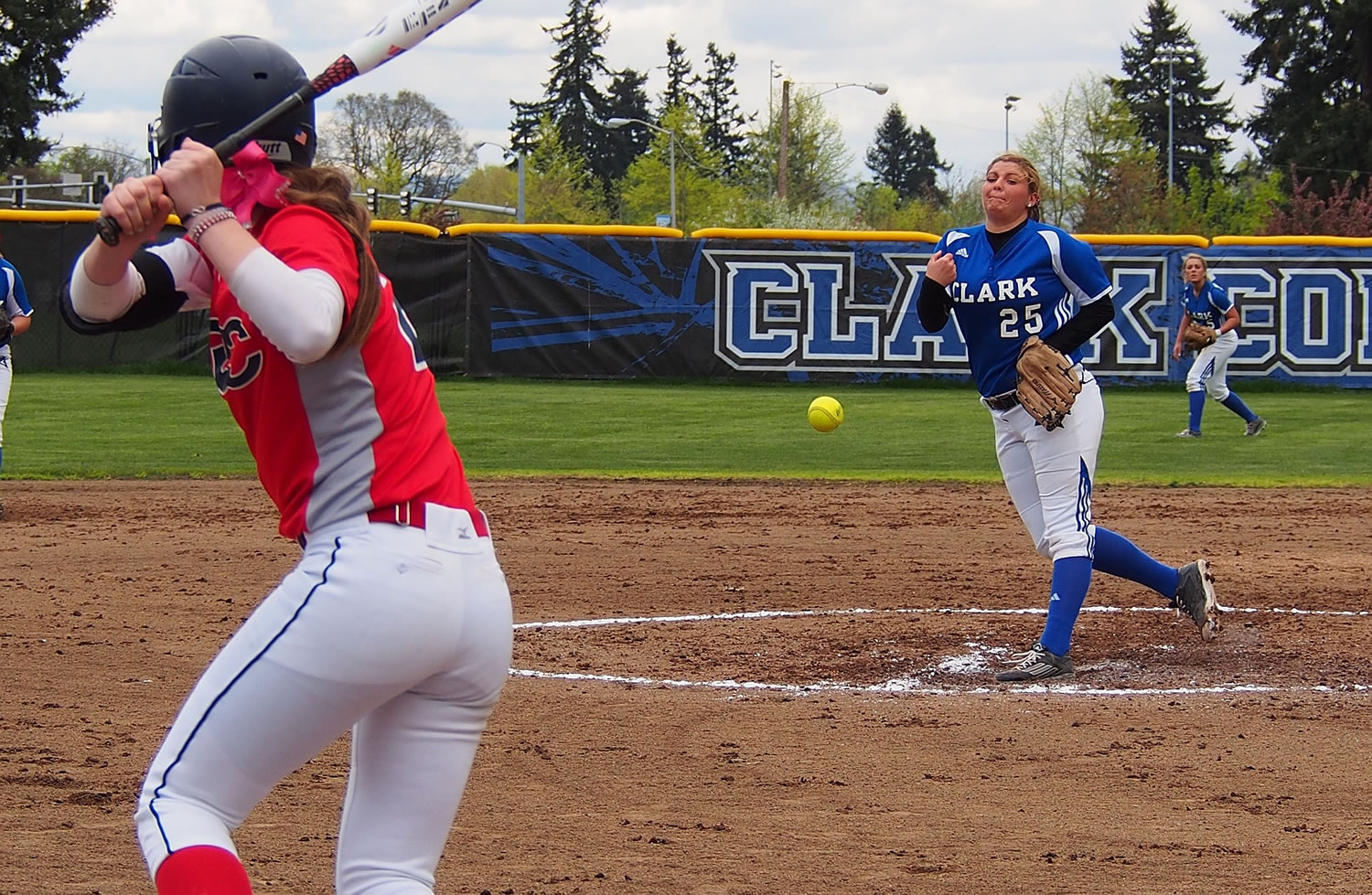 Clark College pitcher Katelyn Lukes delivers to Clackamas batter Cassidy Edwards during the first game of a doubleheader Wednesday, April 8, 2015.